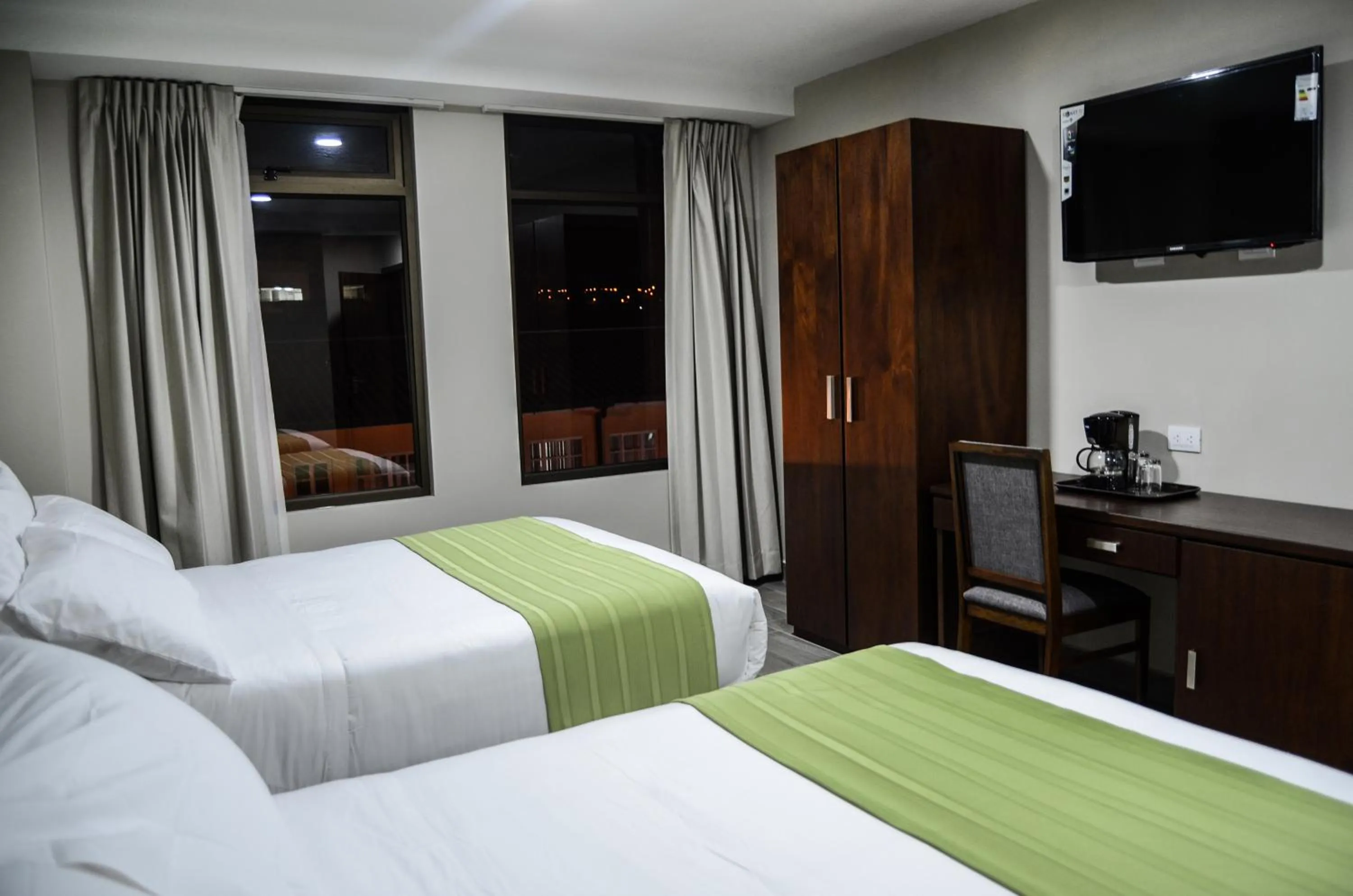 Bed in Hotel San Agustin Plaza