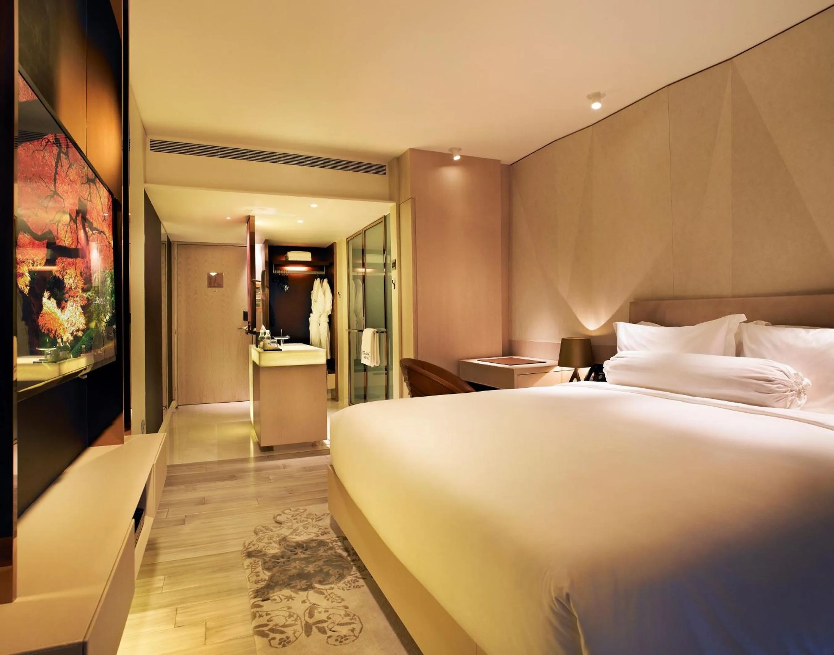 Bed in Naumi Hotel Singapore