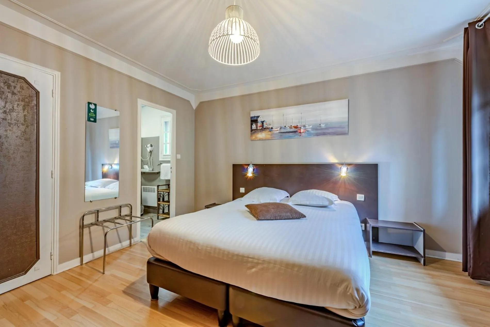 Bed in Logis Hotel De La Corniche