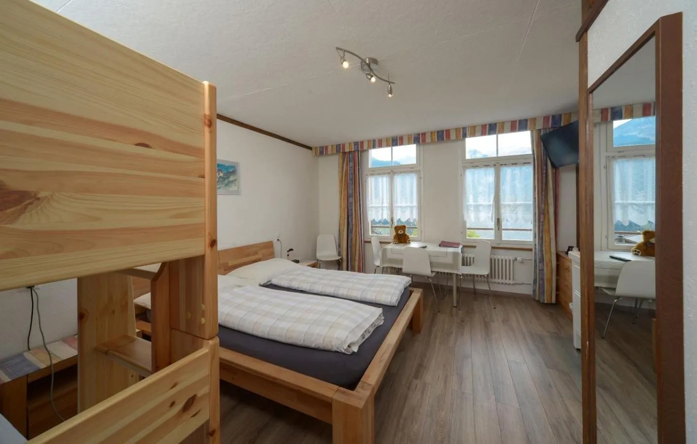 Bedroom, Bed in Swiss Lodge Hotel Bernerhof