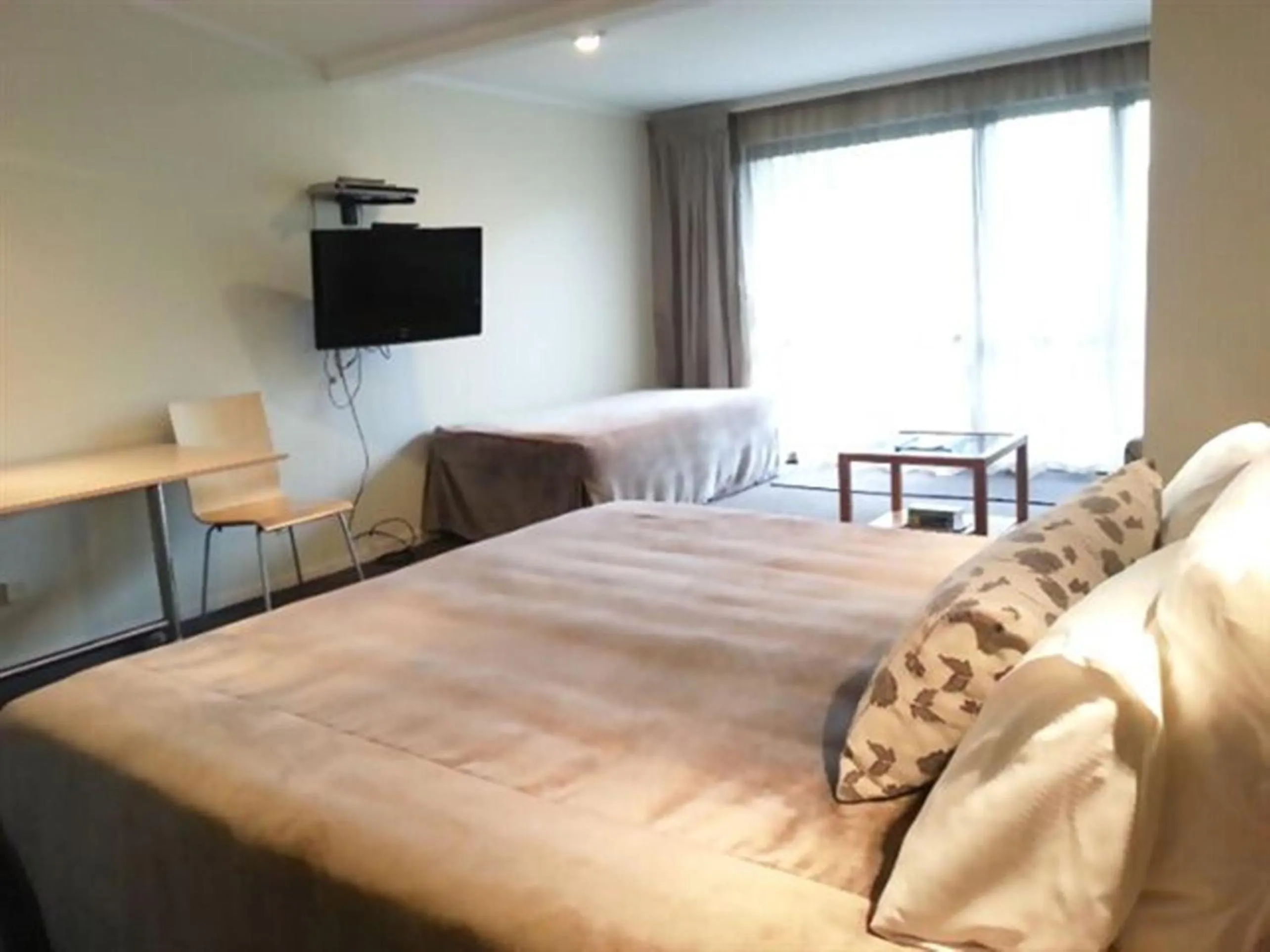 TV and multimedia, Bed in Marineland Beachfront Accommodation