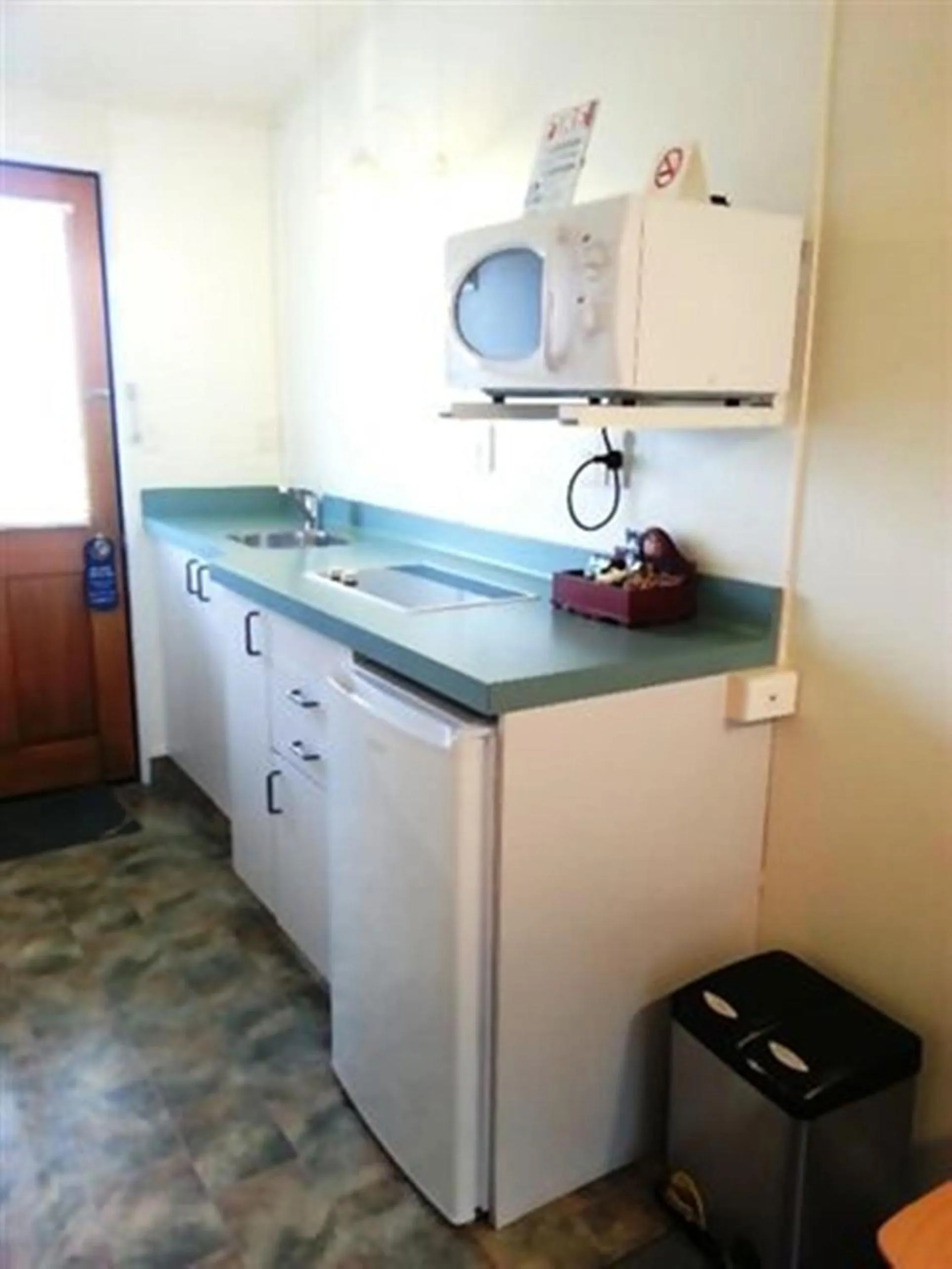 Kitchen or kitchenette in Marineland Beachfront Accommodation