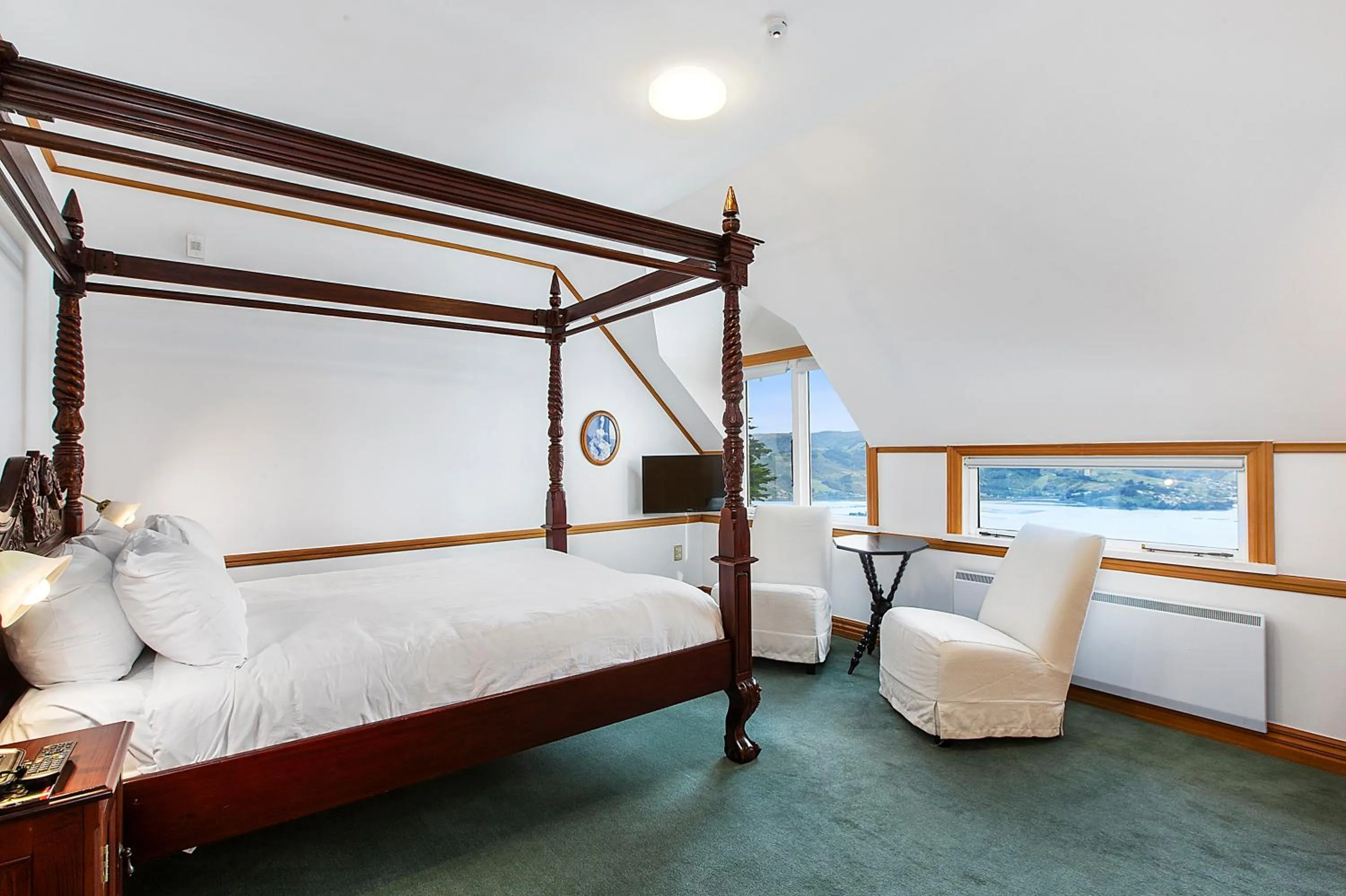 Bed in Larnach Lodge & Stable Stay