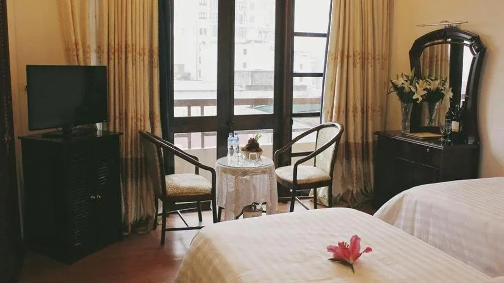 Bed in Cosiana Hue Hotel