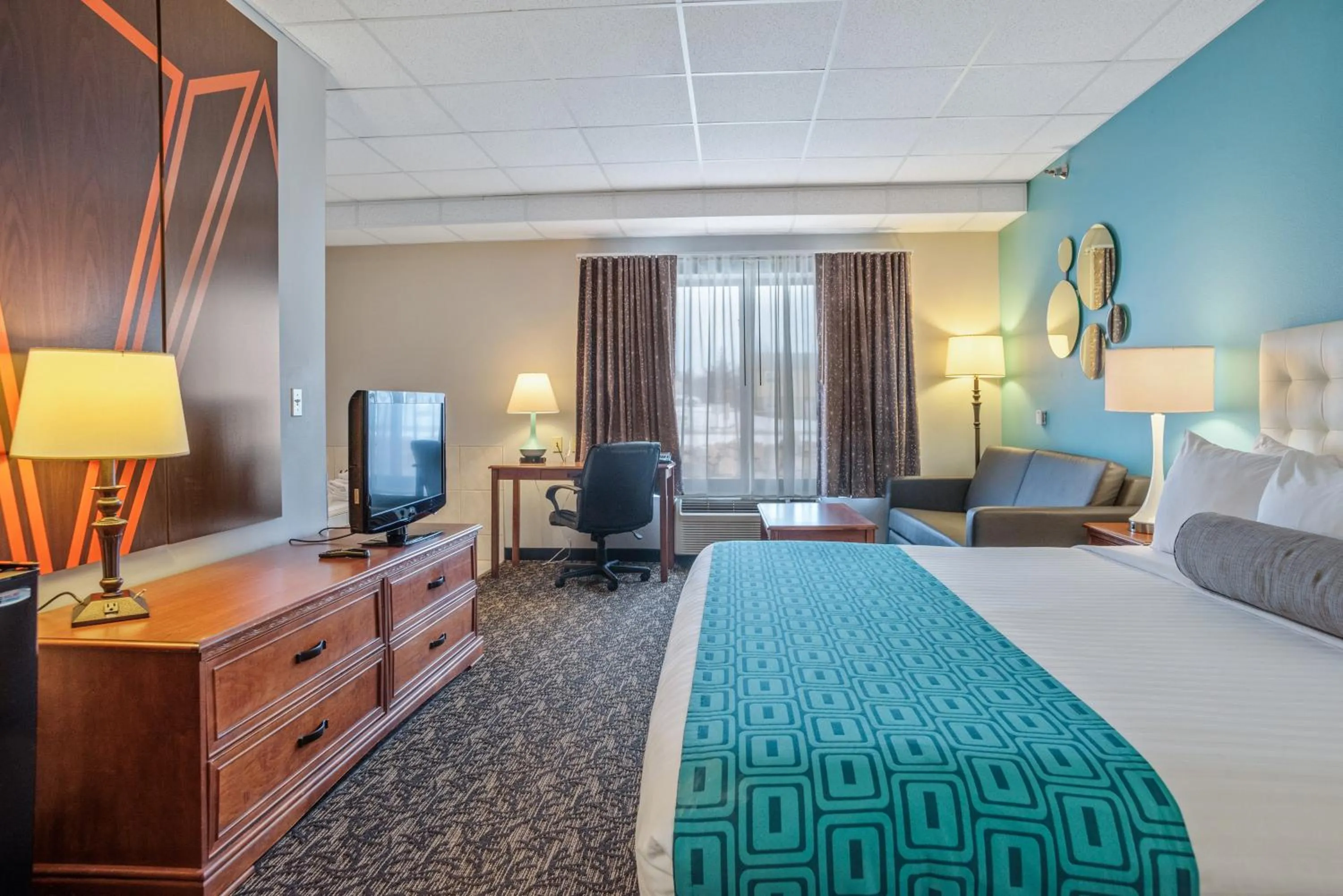 Bed in Elevation Inn & Suites, Trademark Collection by Wyndham