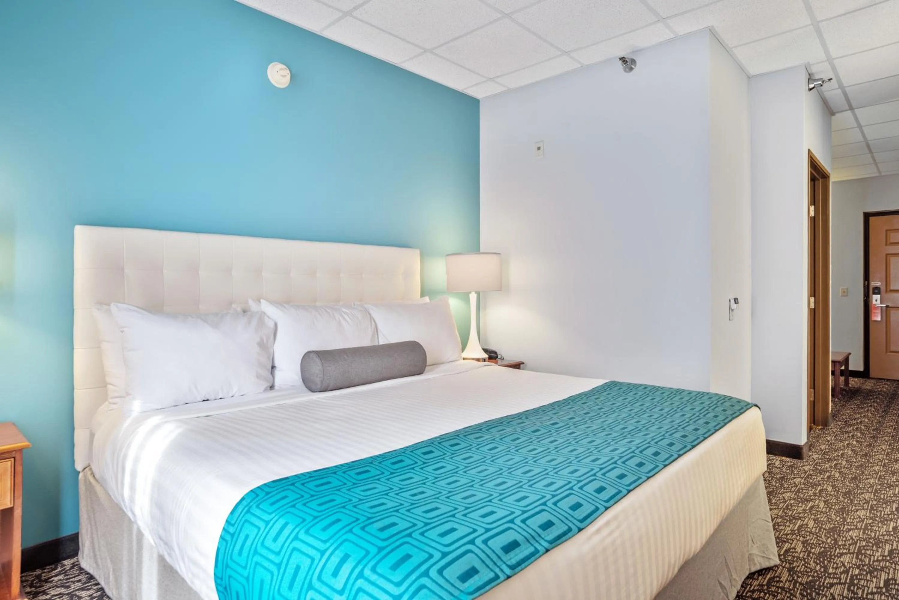 Bed in Elevation Inn & Suites, Trademark Collection by Wyndham