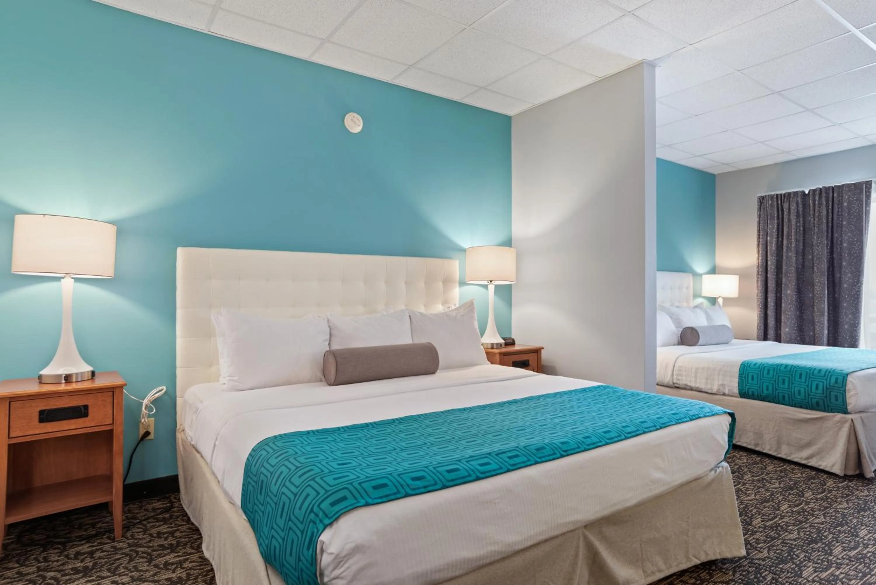 Bed in Elevation Inn & Suites, Trademark Collection by Wyndham