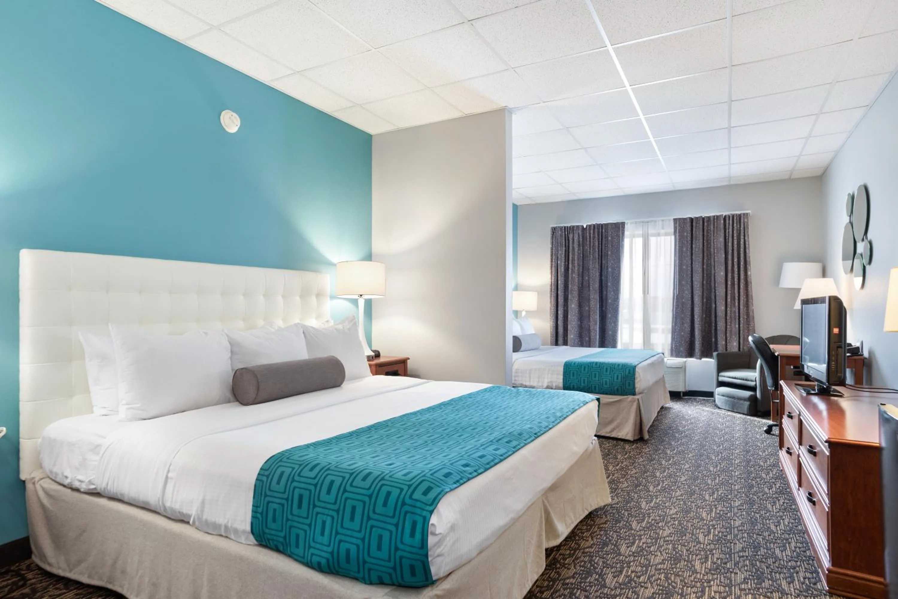 Bed in Elevation Inn & Suites, Trademark Collection by Wyndham