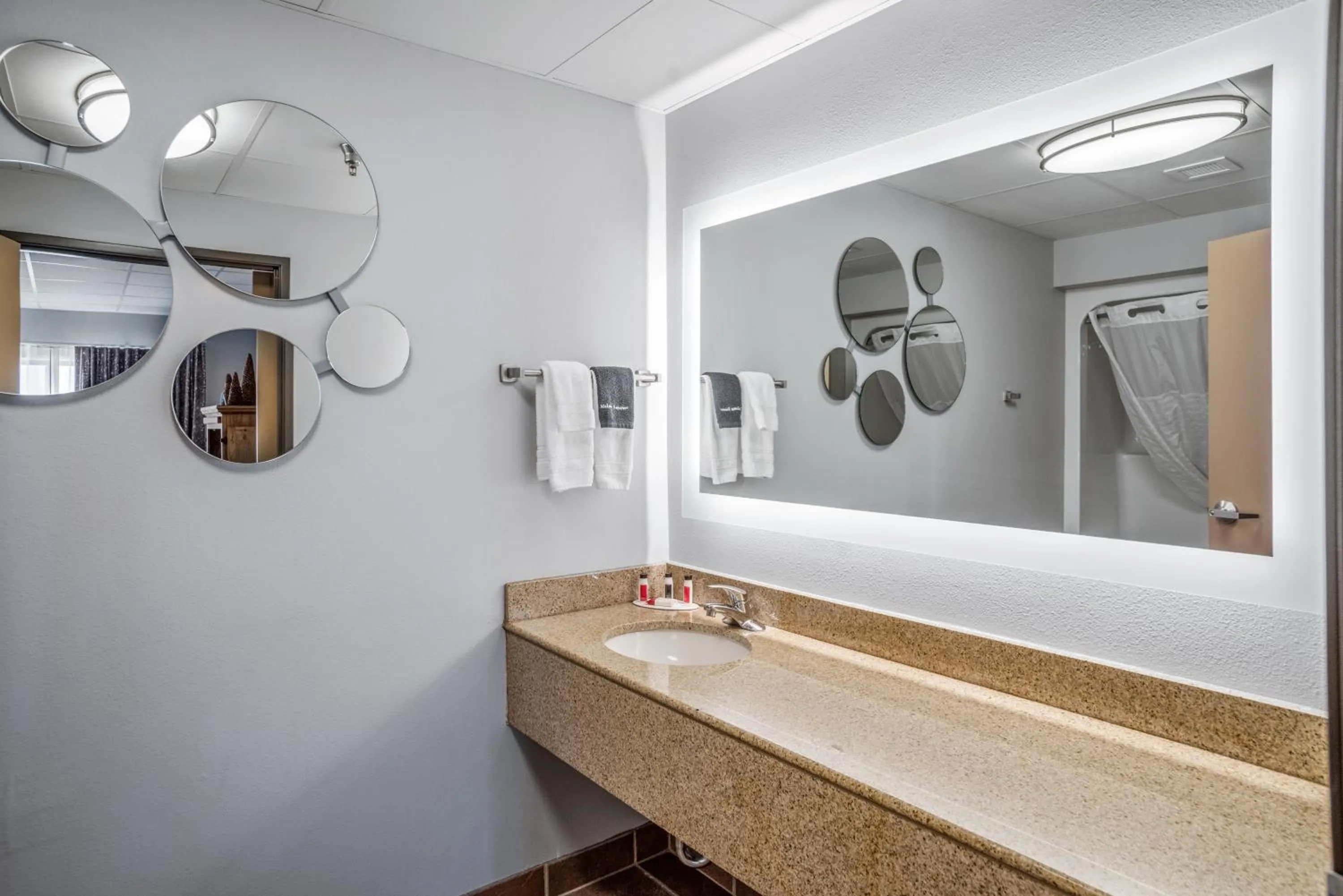 Bathroom in Elevation Inn & Suites, Trademark Collection by Wyndham