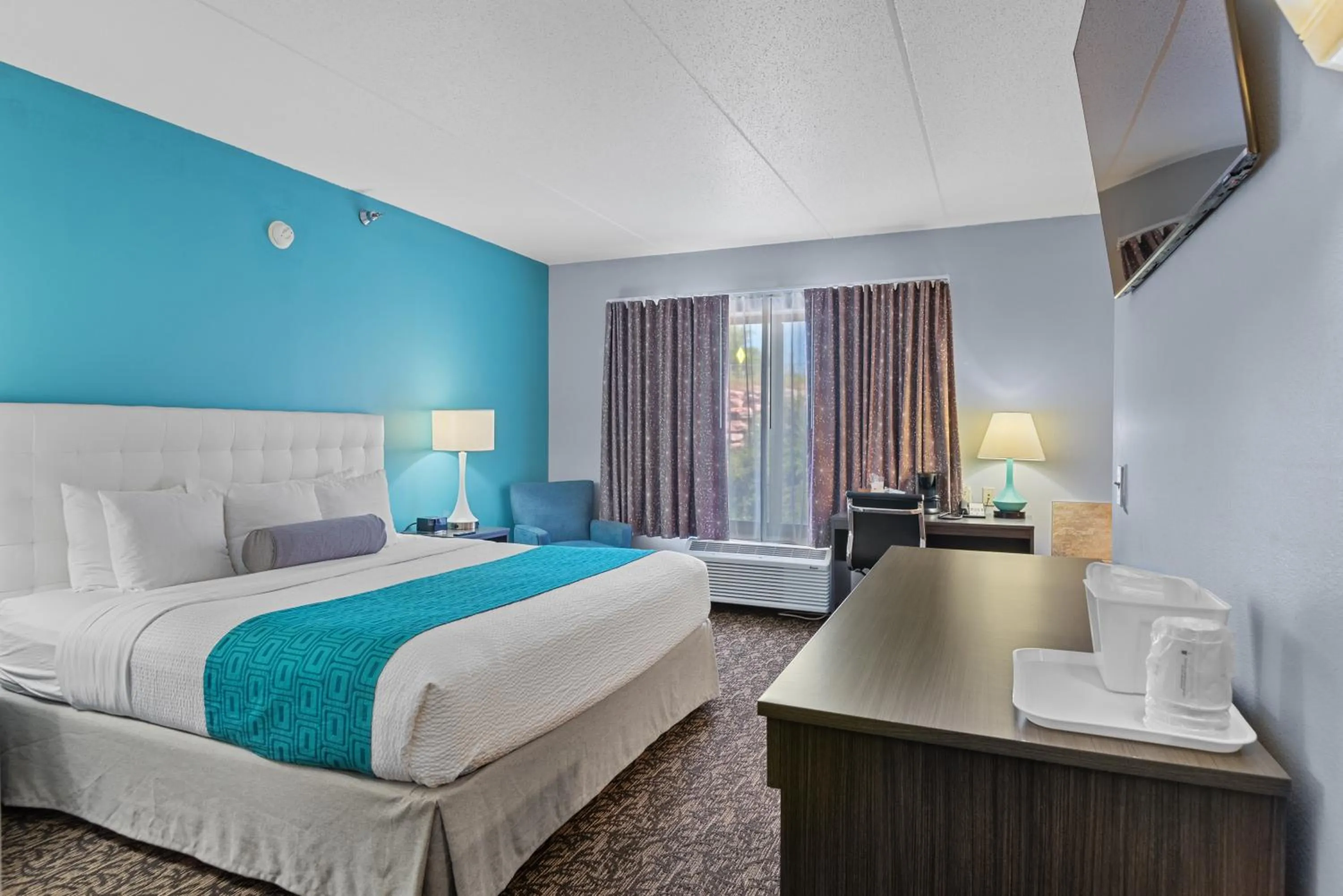 Bed in Elevation Inn & Suites, Trademark Collection by Wyndham