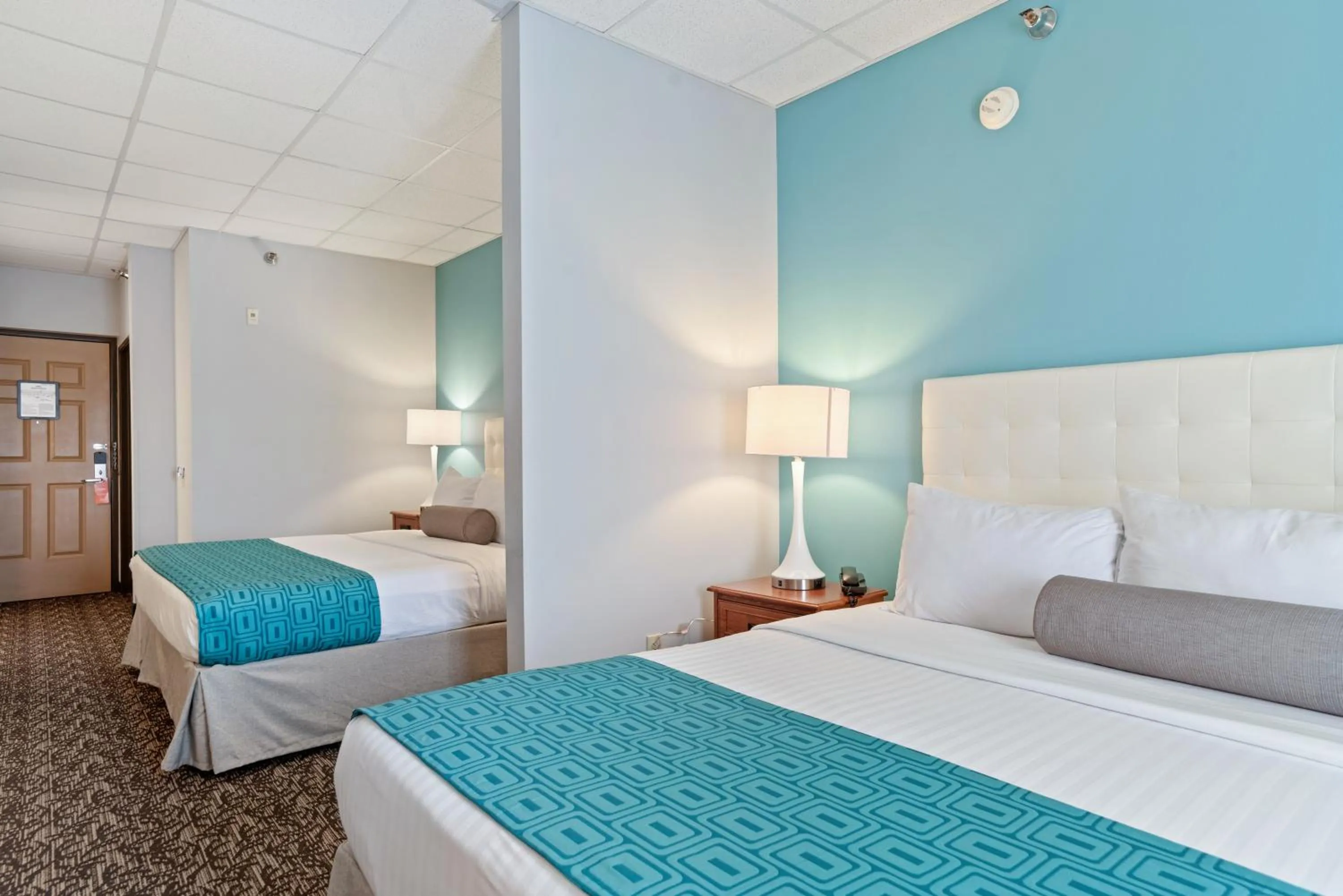 Bed in Elevation Inn & Suites, Trademark Collection by Wyndham