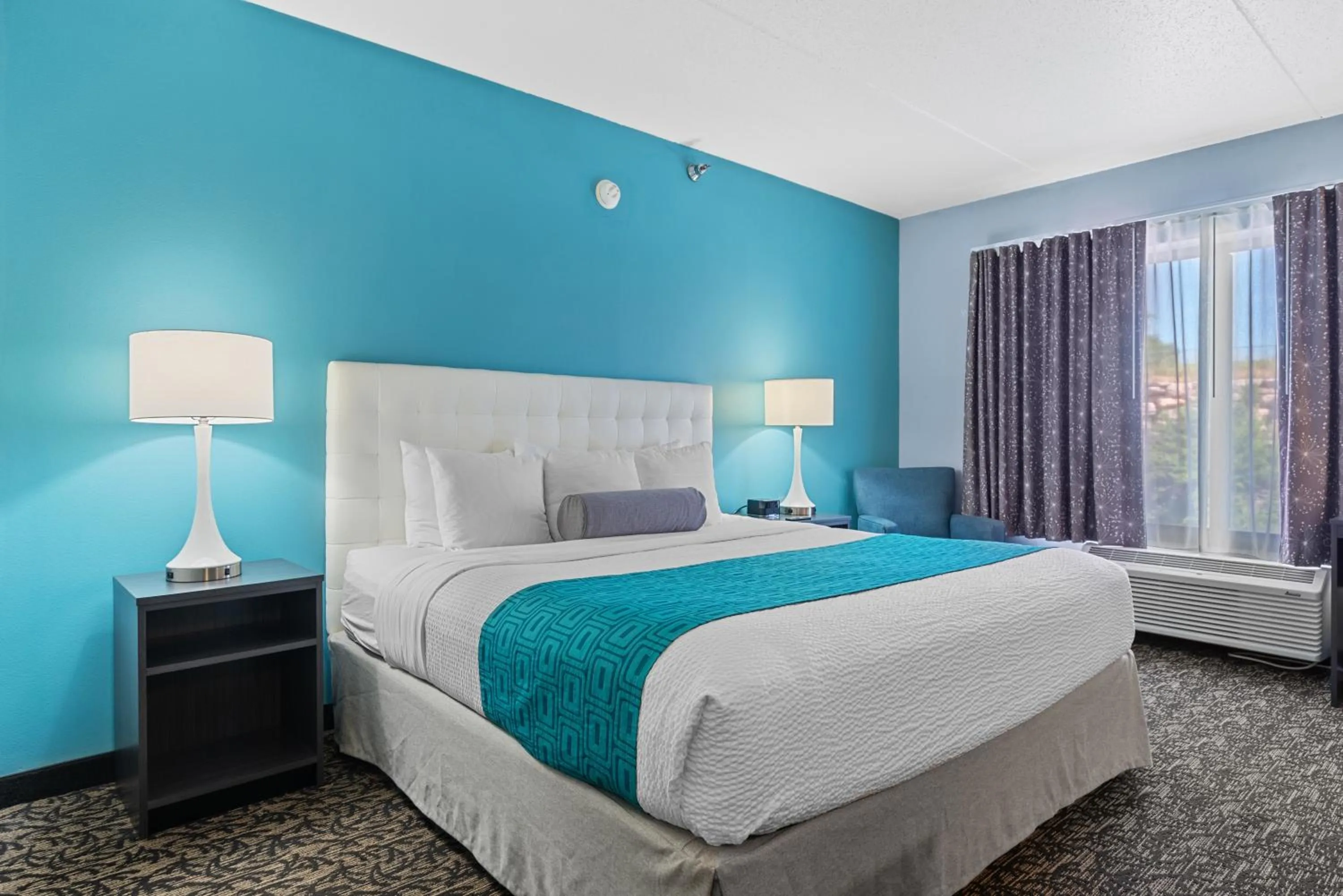 Bed in Elevation Inn & Suites, Trademark Collection by Wyndham