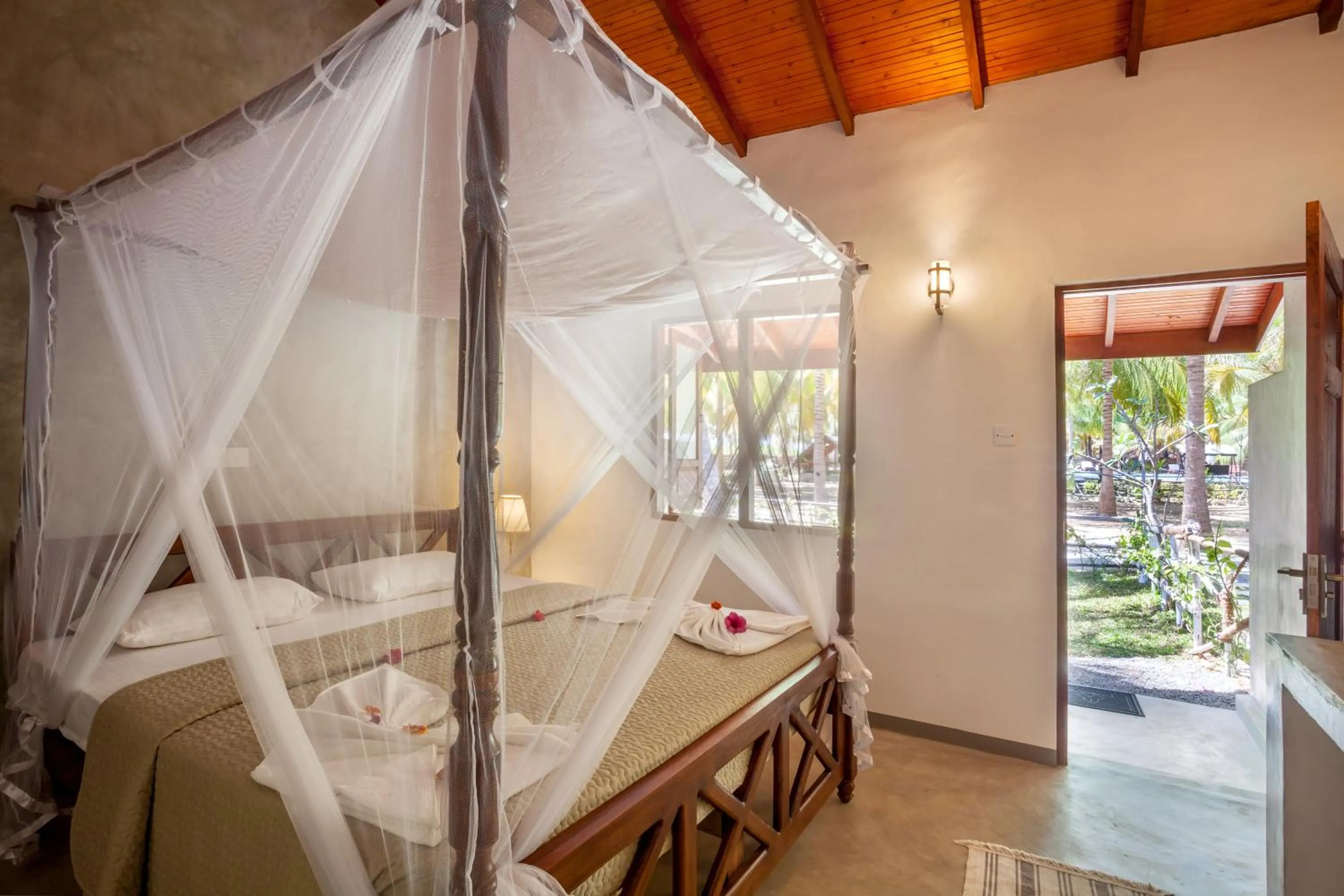 Bed in De Silva Palm Resort