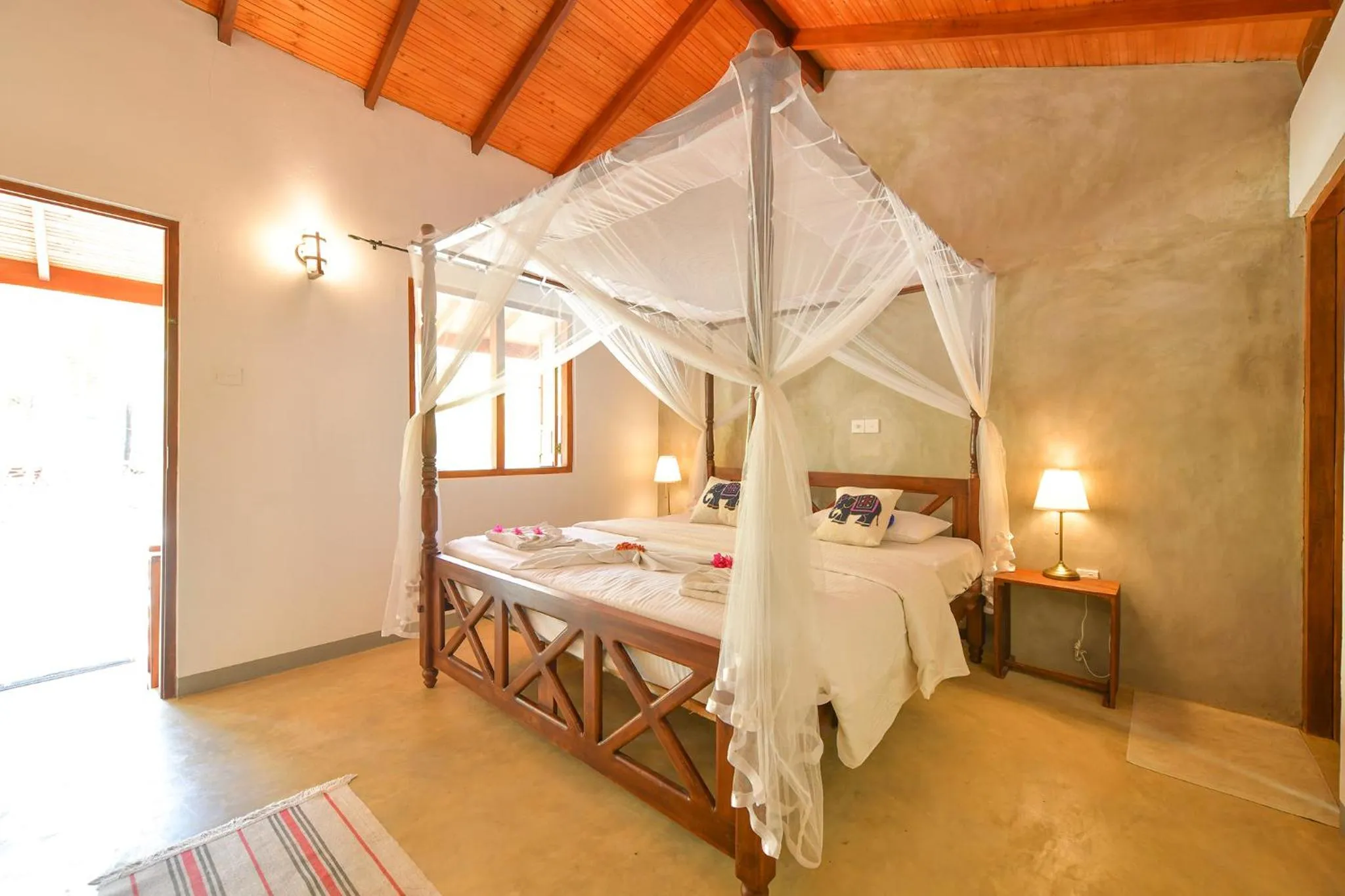 Bed in De Silva Palm Resort