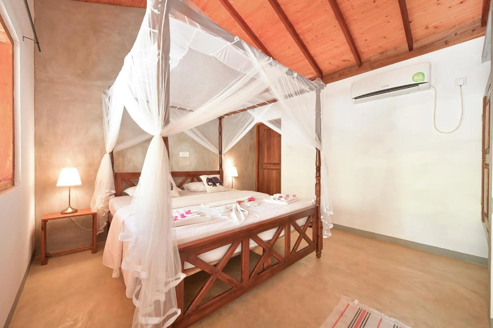 Bed in De Silva Palm Resort