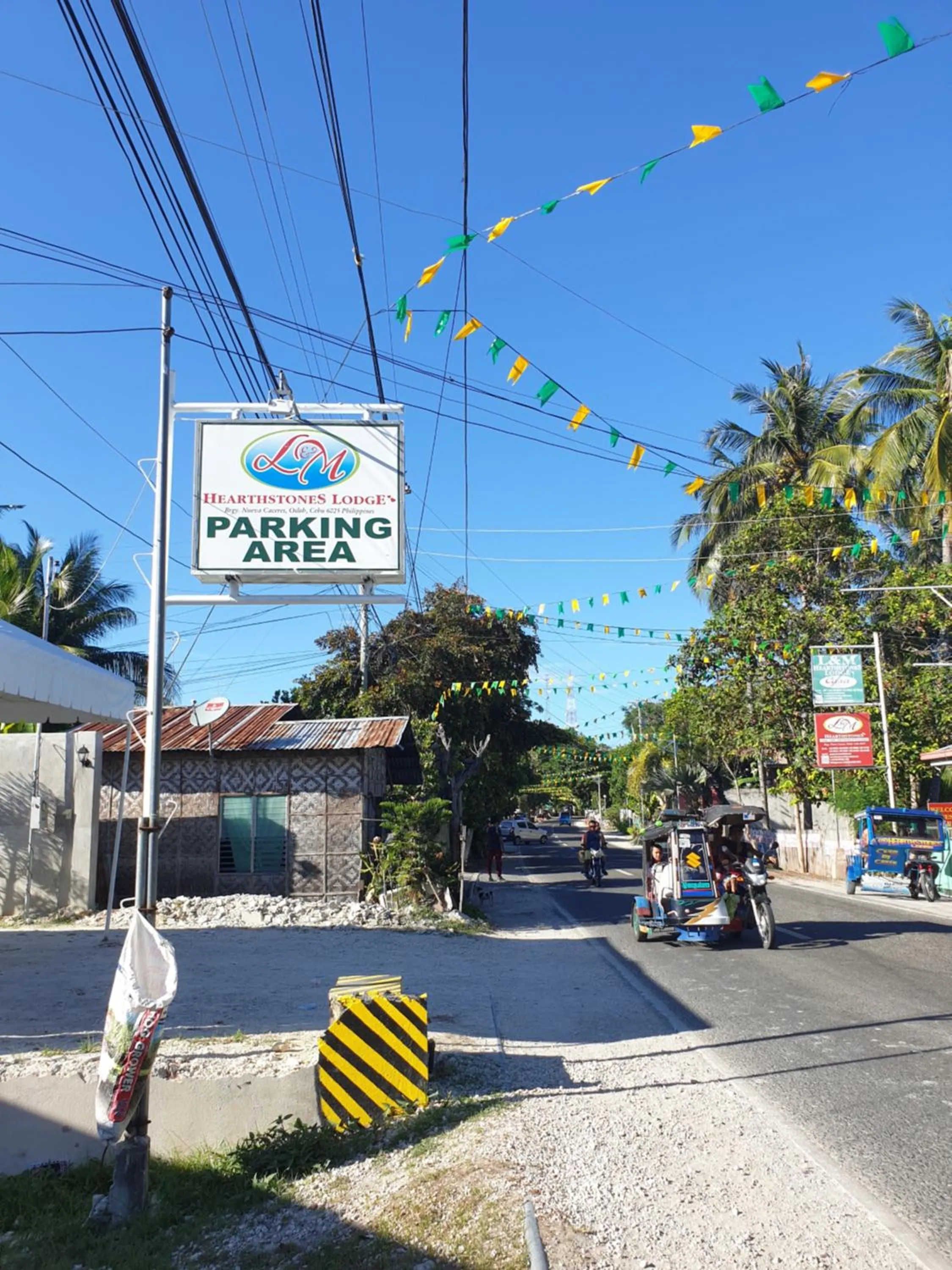 Property logo or sign in L & M Hearthstones Lodge