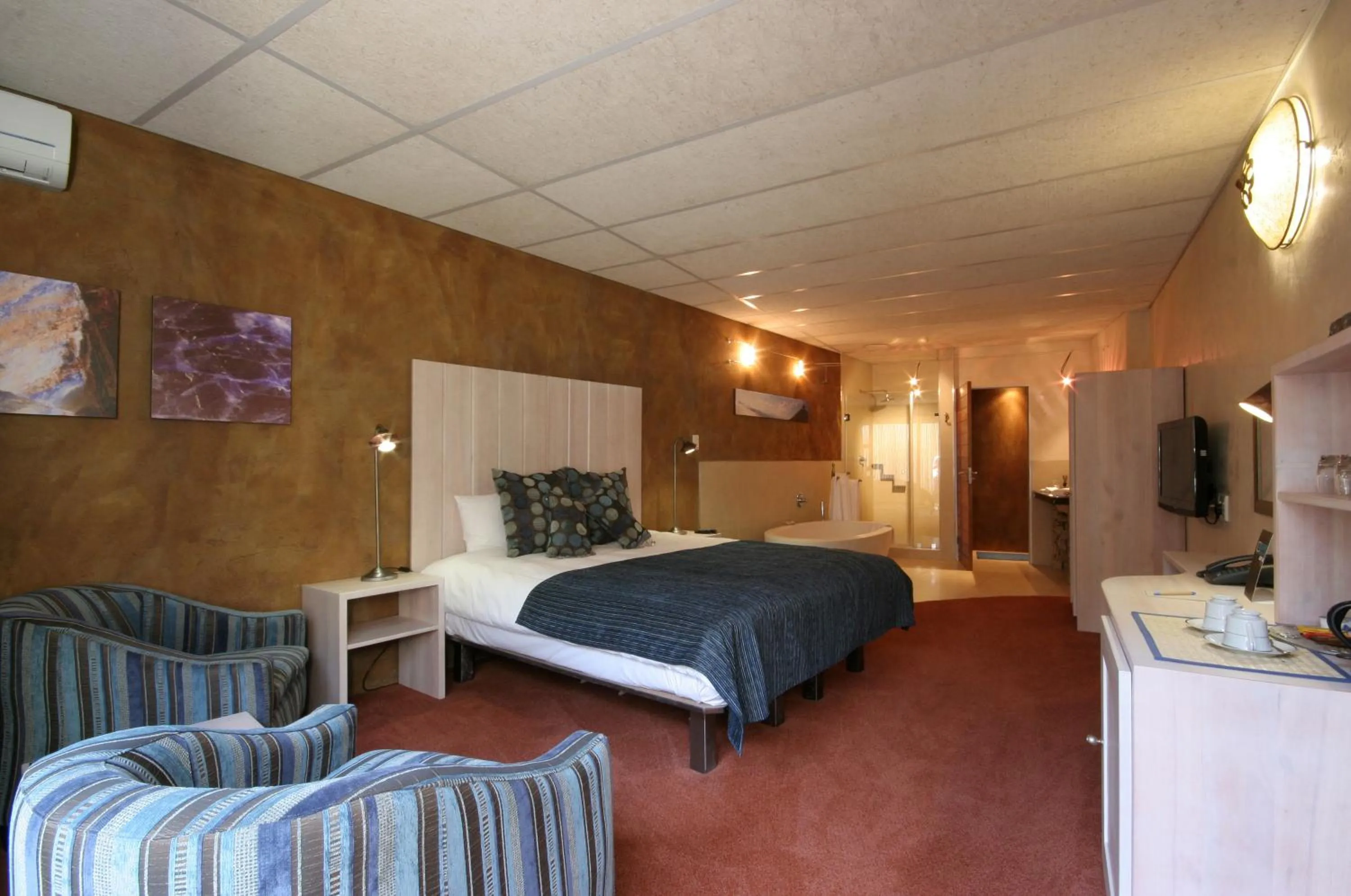 Bathroom, Bed in African Rock Hotel & Spa, a "Boutique Lifestyle Resort"
