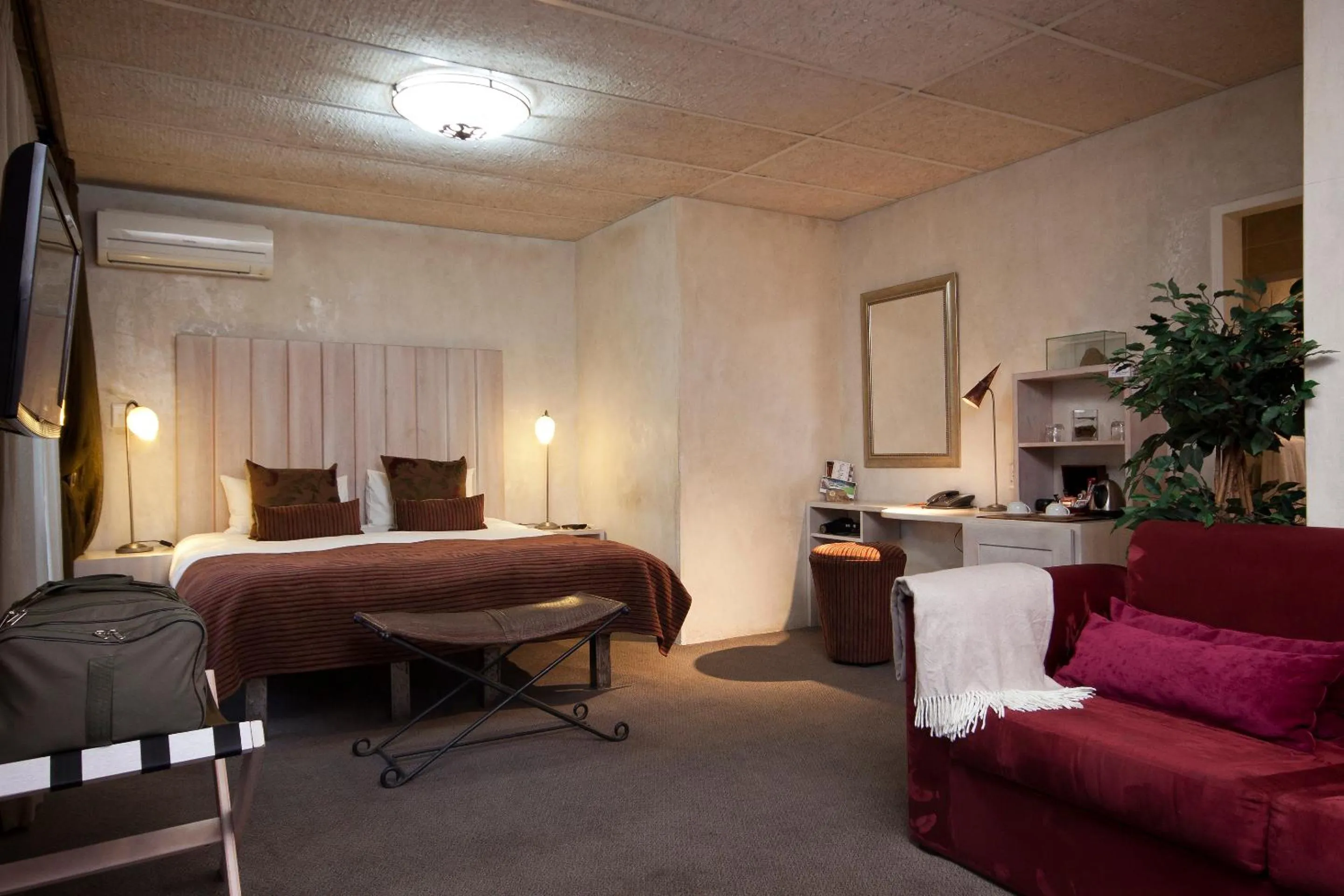 Seating area, Bed in African Rock Hotel & Spa, a "Boutique Lifestyle Resort"