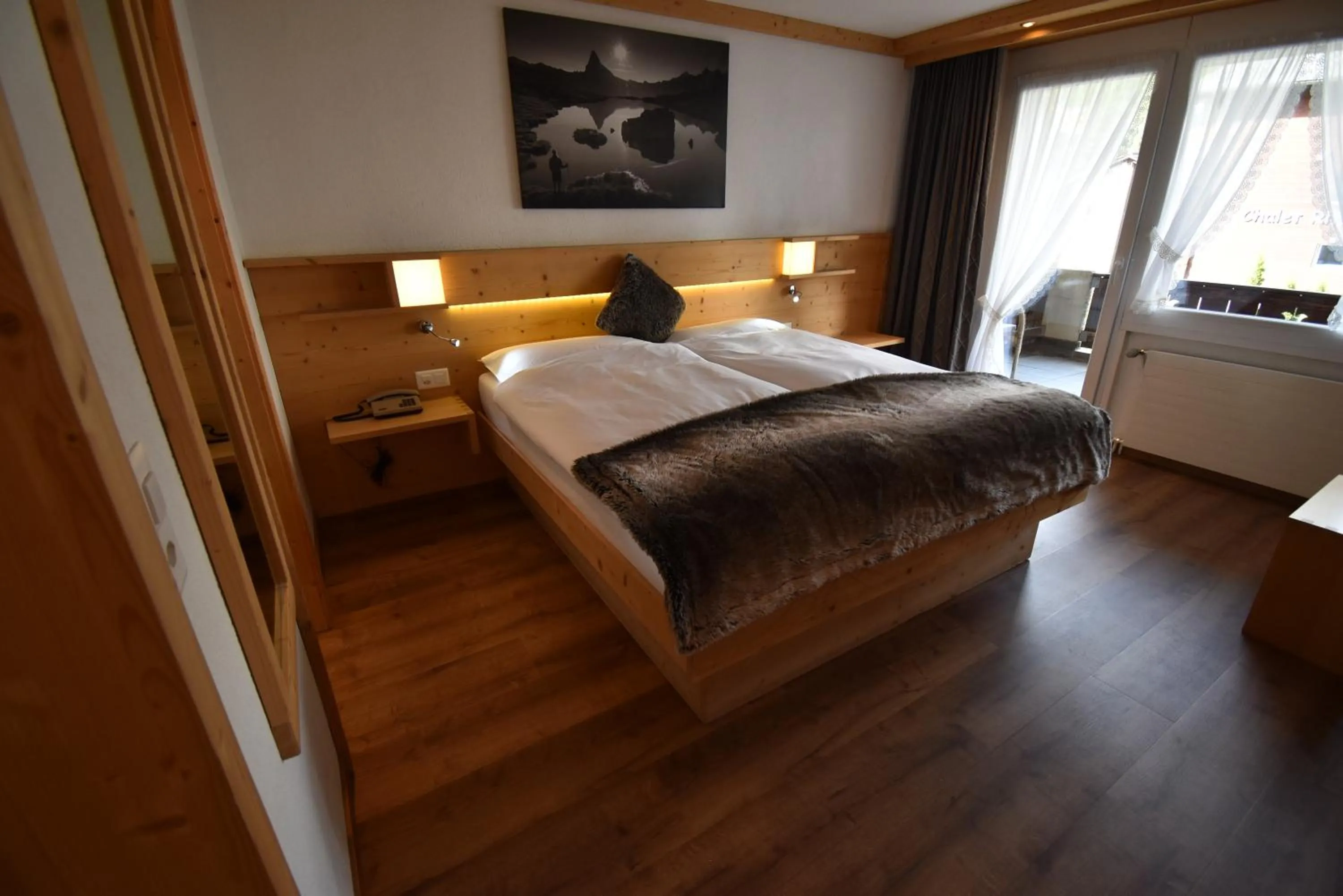 Photo of the whole room, Bed in Hotel Matterhornblick