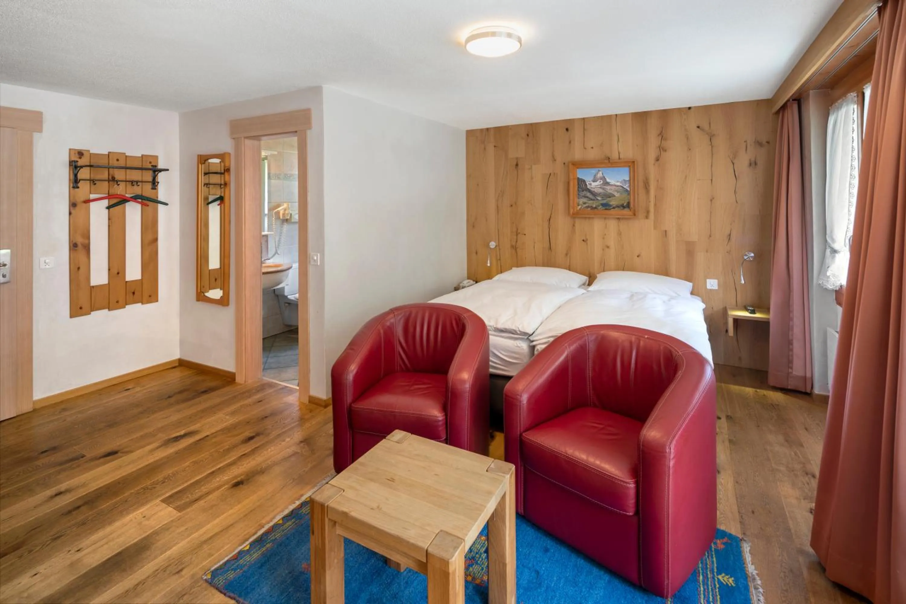 Bathroom, Bed in Hotel Matterhornblick