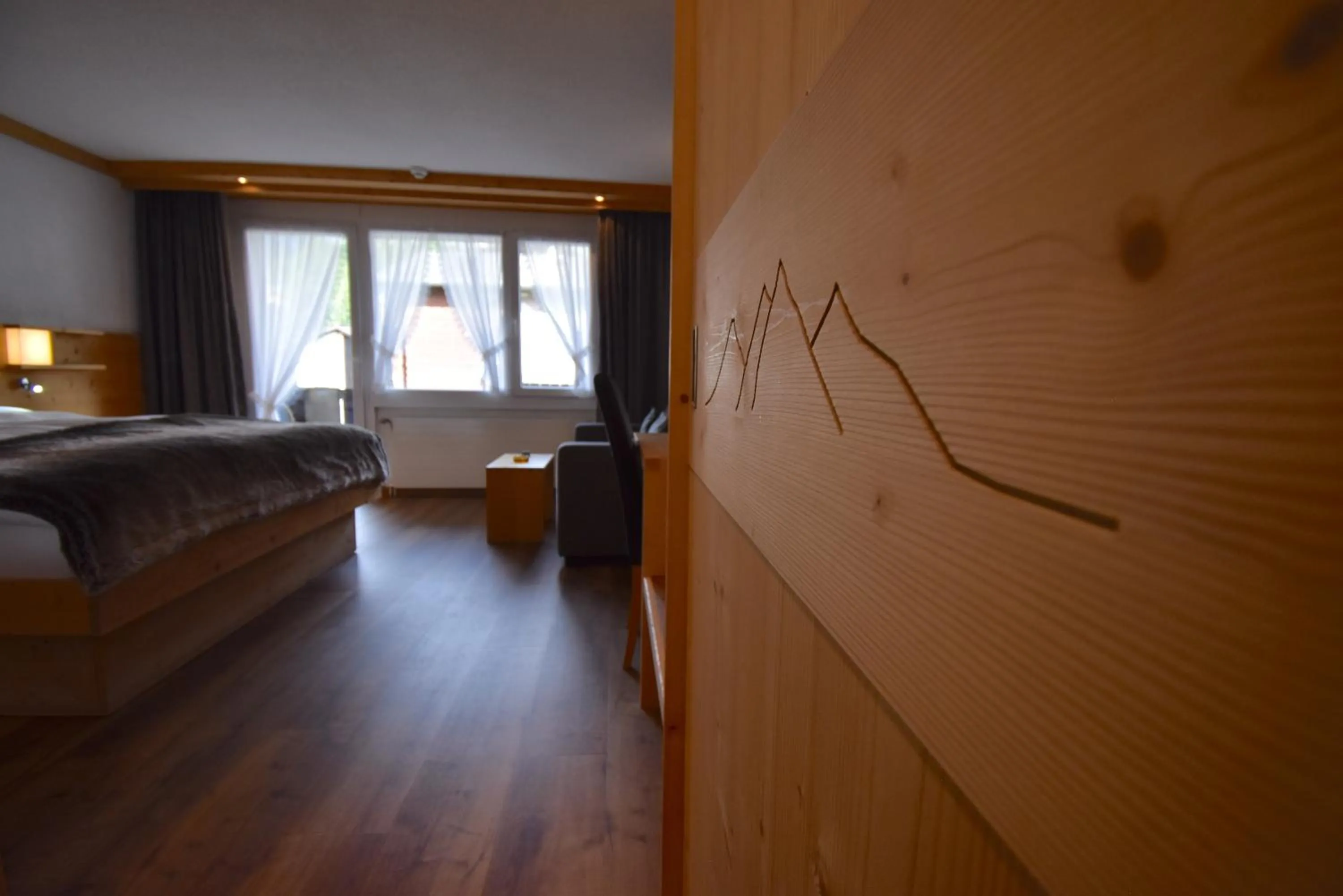 Photo of the whole room, Bed in Hotel Matterhornblick