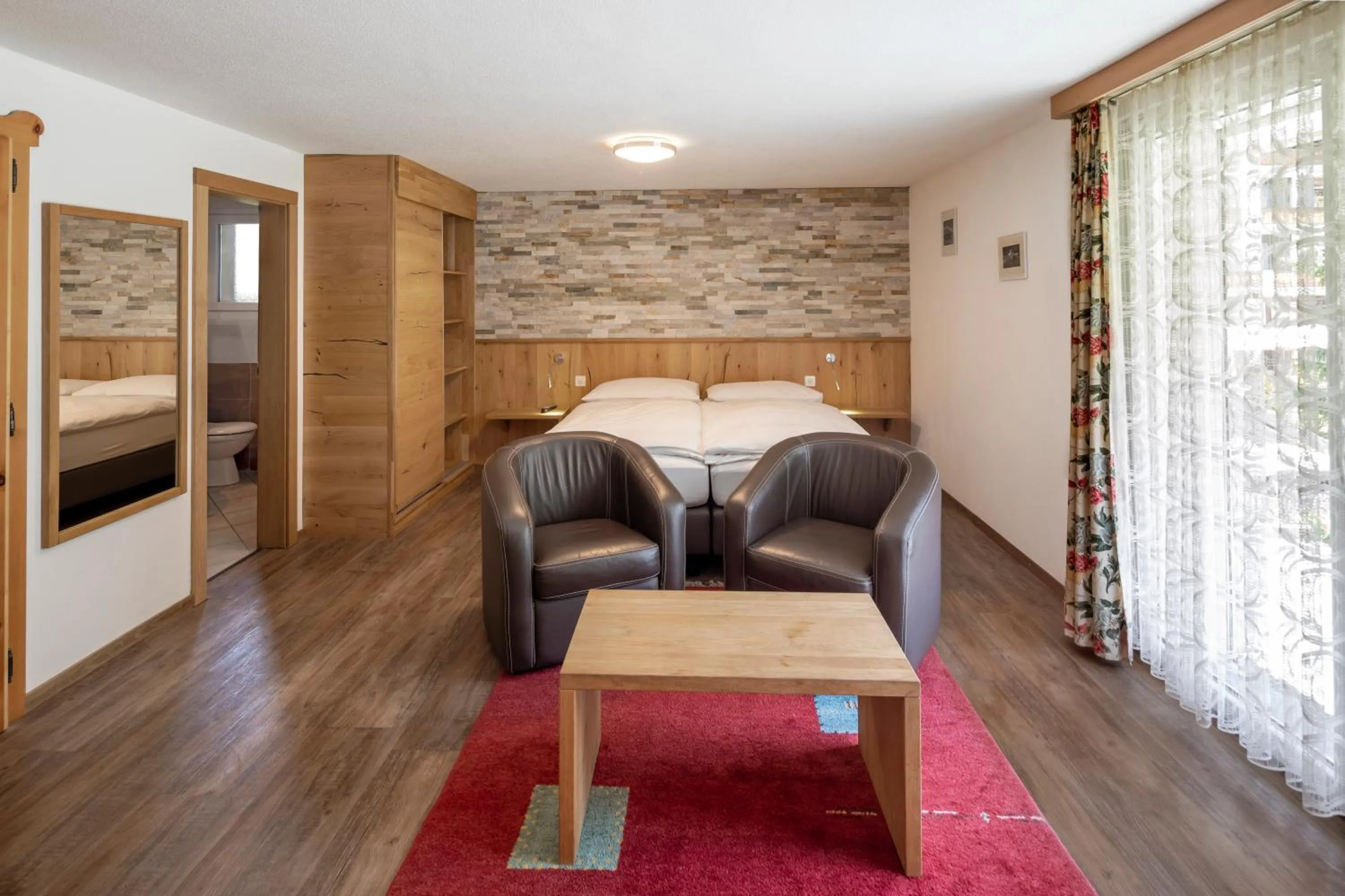 Kitchen or kitchenette, Bed in Hotel Matterhornblick