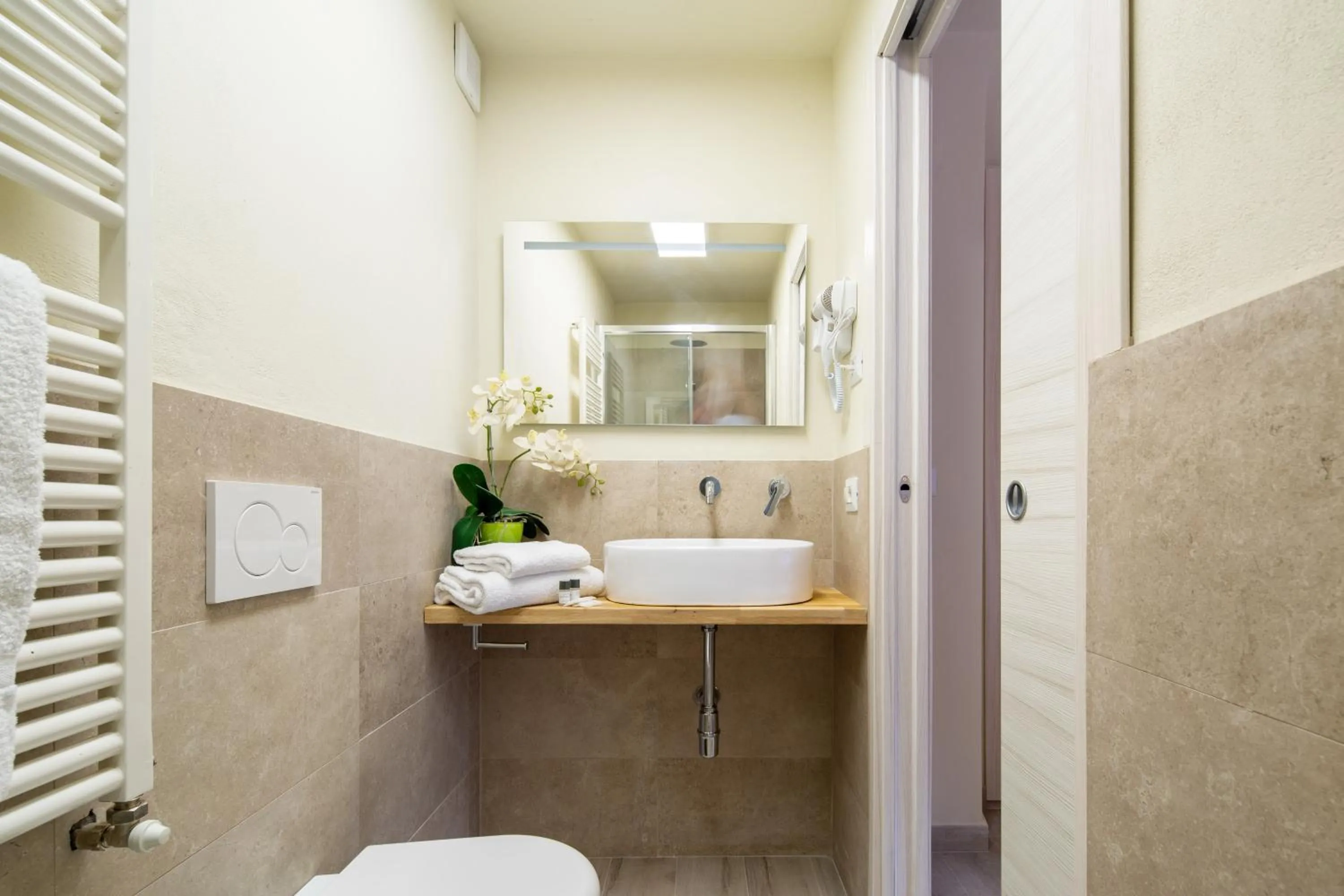 Bathroom in Duomo Apartments by Mmega
