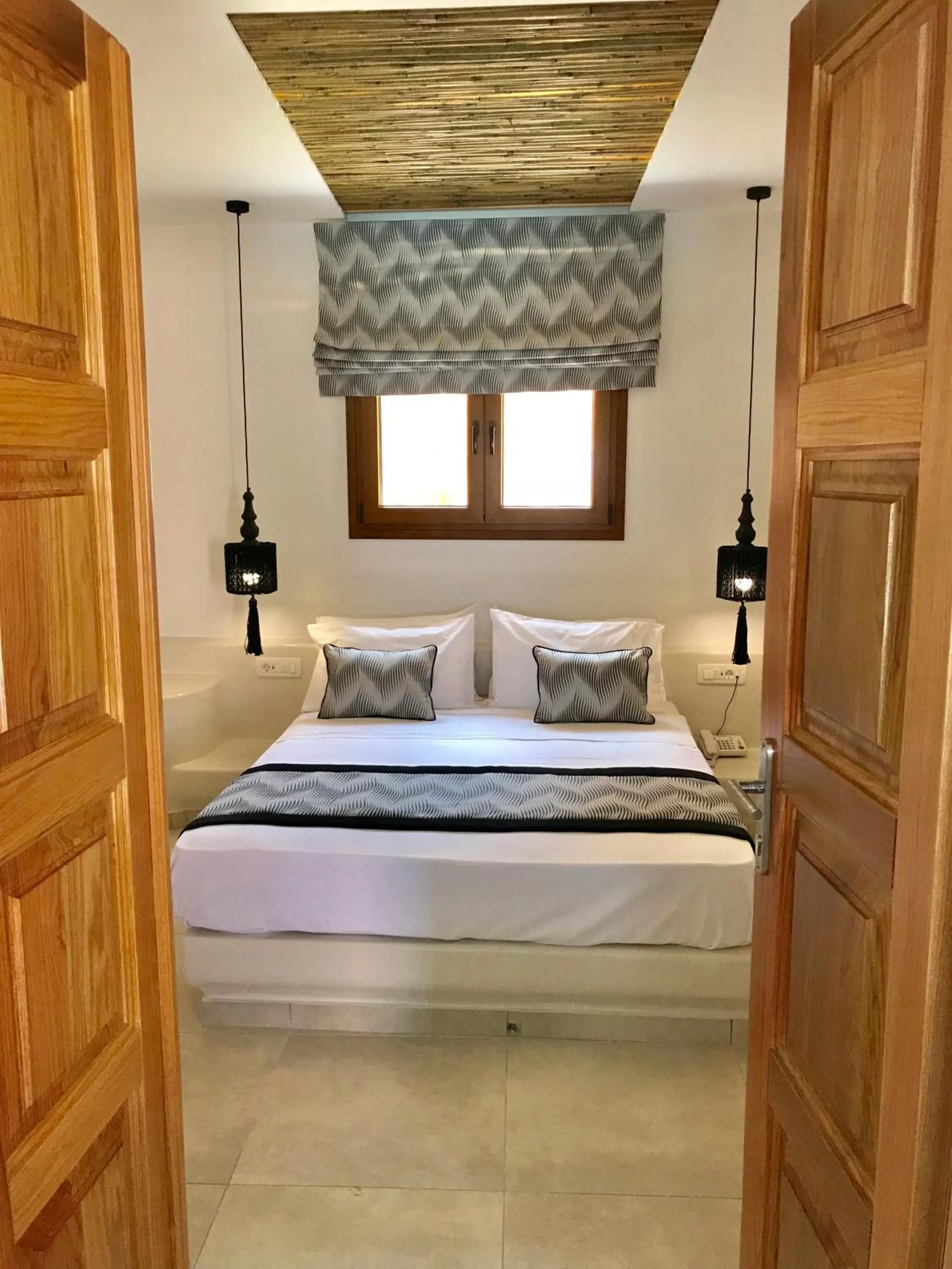 Bed in Perla Nera Suites