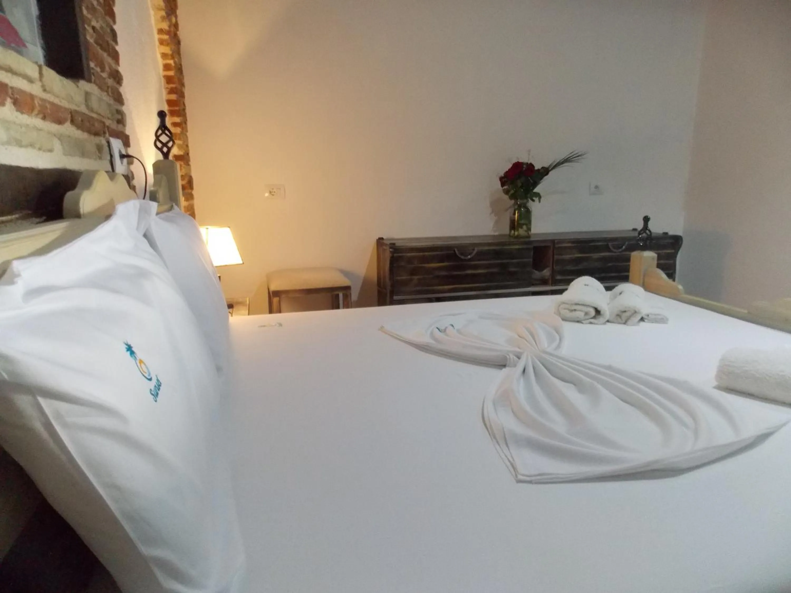 Bed in Sunset Suites