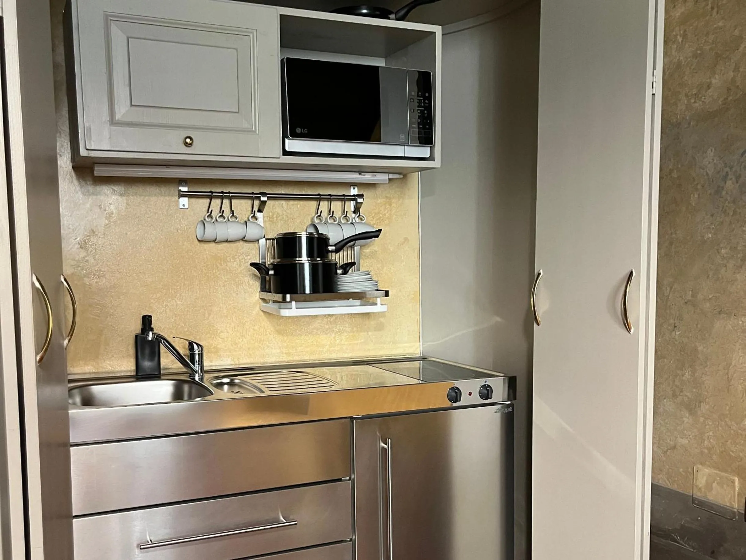 Kitchen or kitchenette in Numa Florence Palazzo San Niccolò