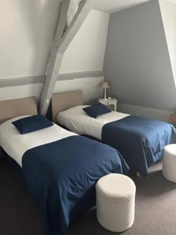 Bed in Logis Hôtel de la Tour