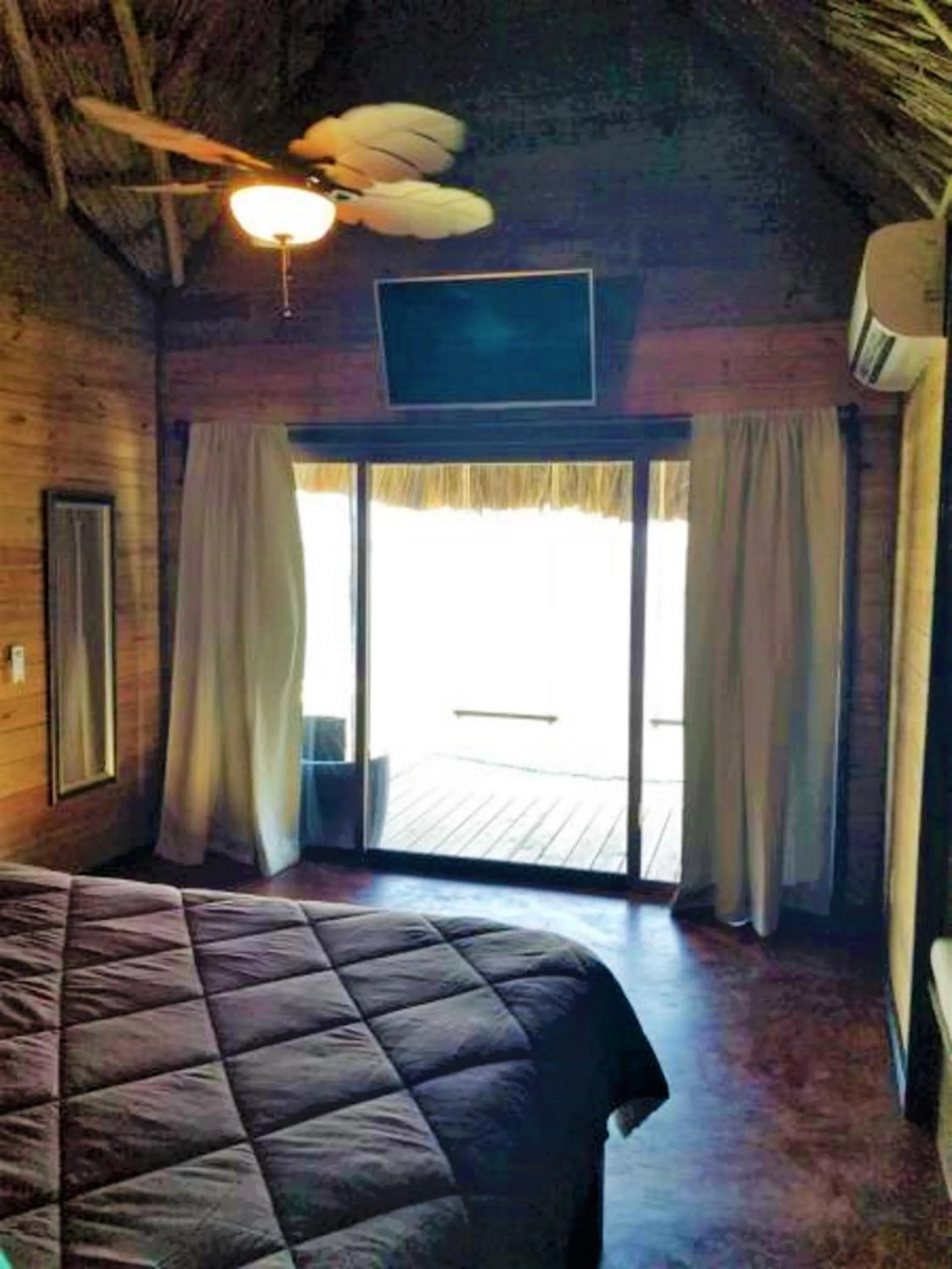 Bed in Lina Point Belize Overwater Resort