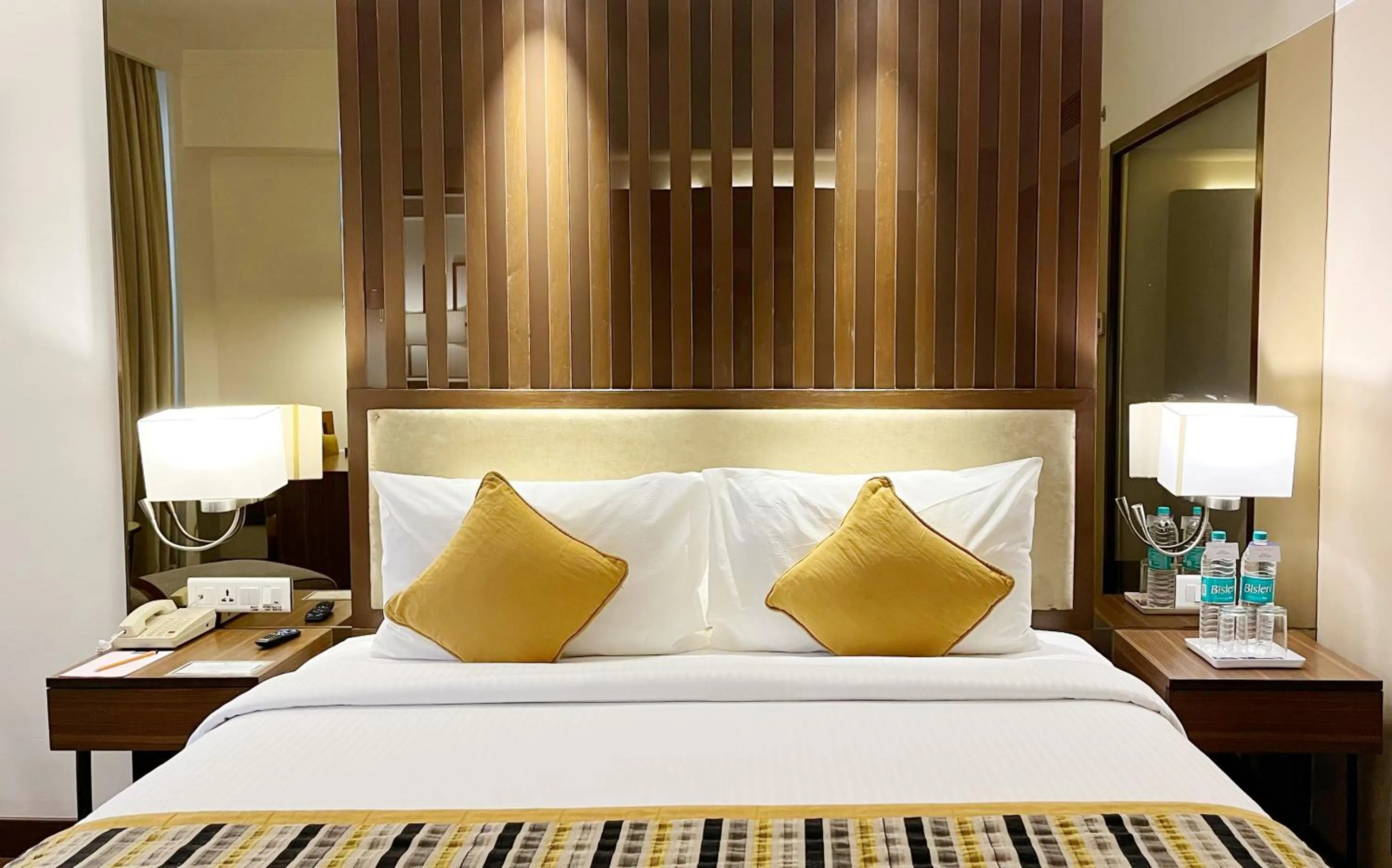 Bed in Aditya Park-A Sarovar Portico Hotel