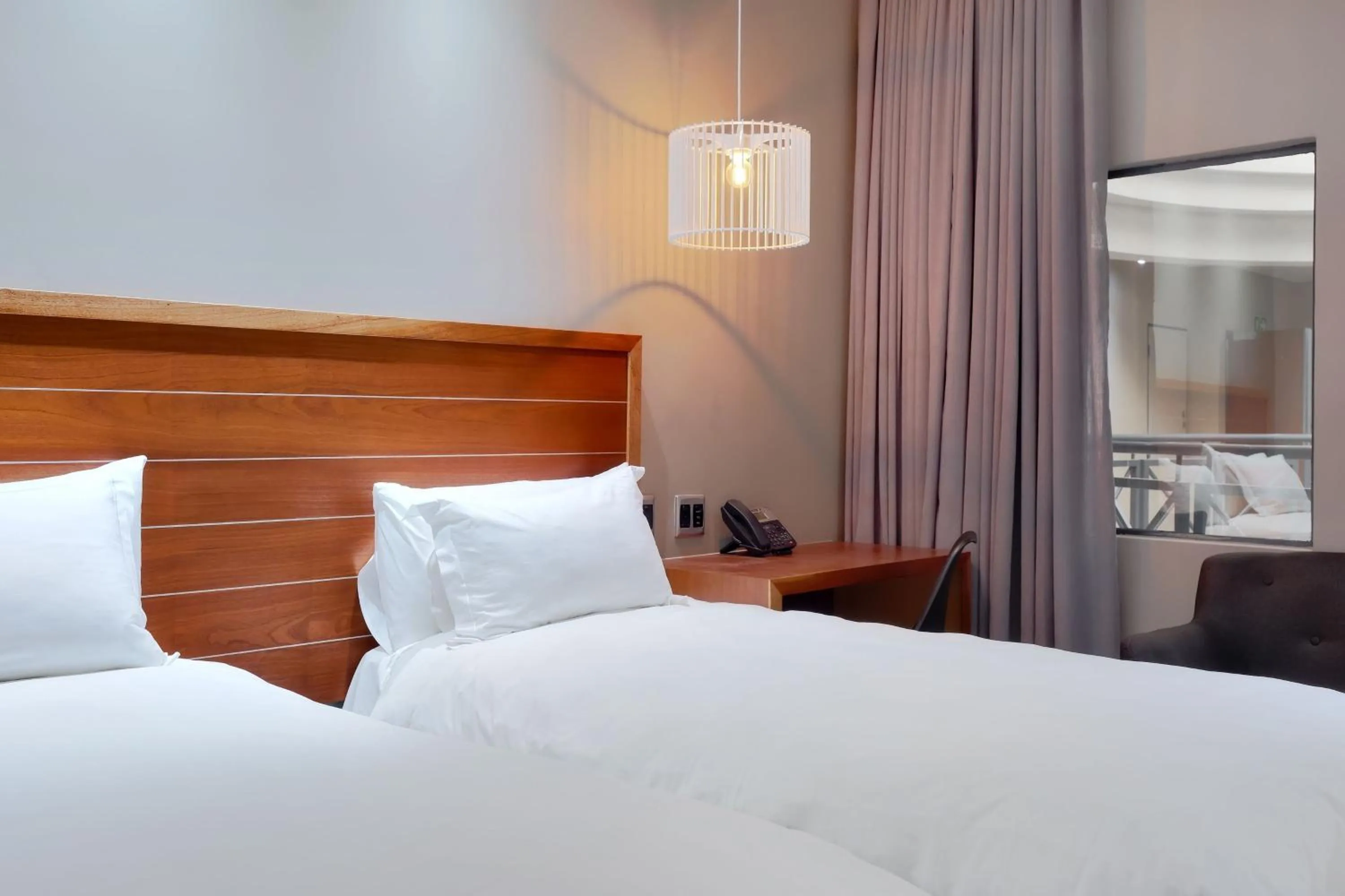 Photo of the whole room, Bed in Protea Hotel by Marriott Pretoria Hatfield