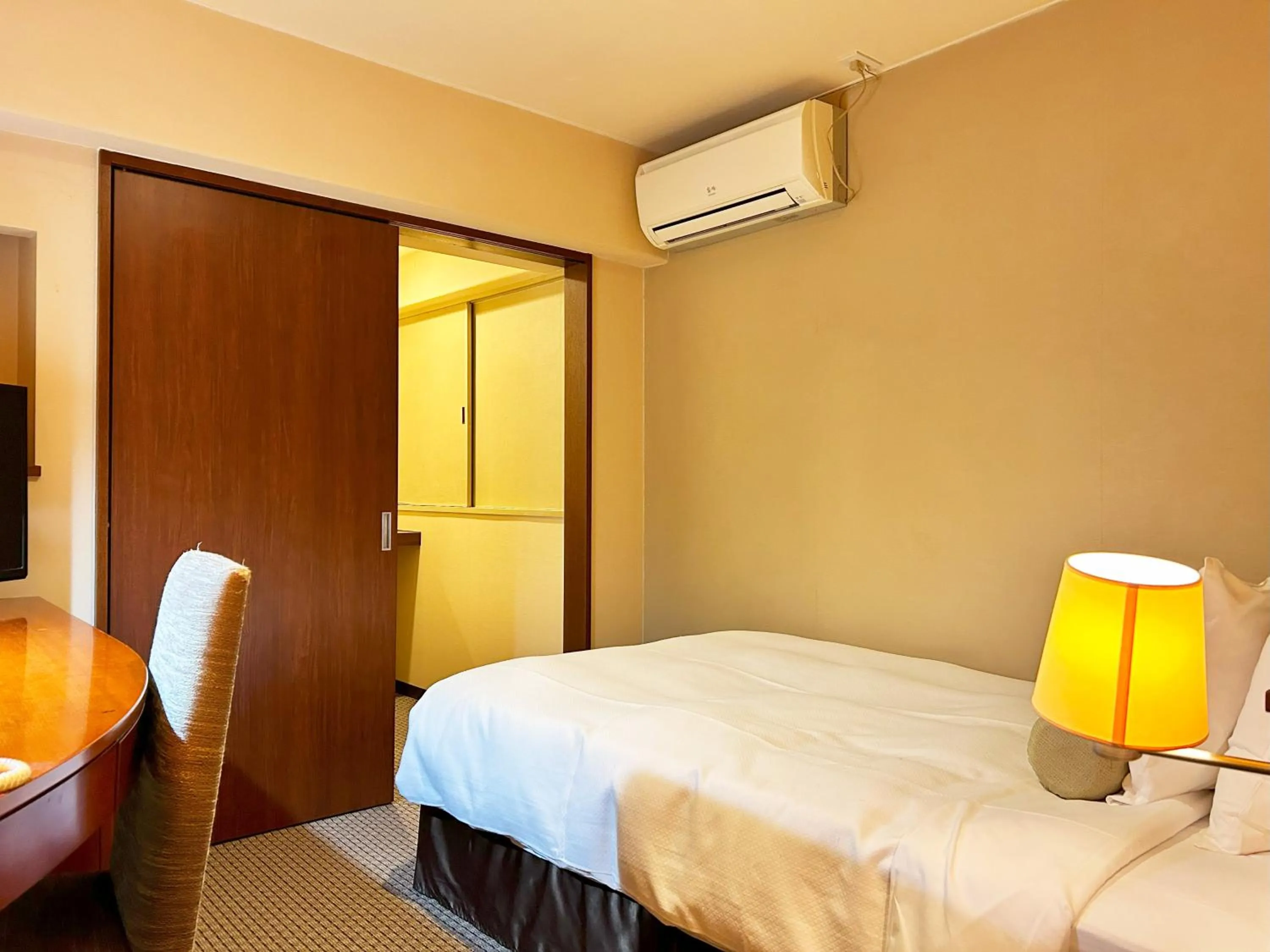 Bed in Nakajimaya Grand Hotel