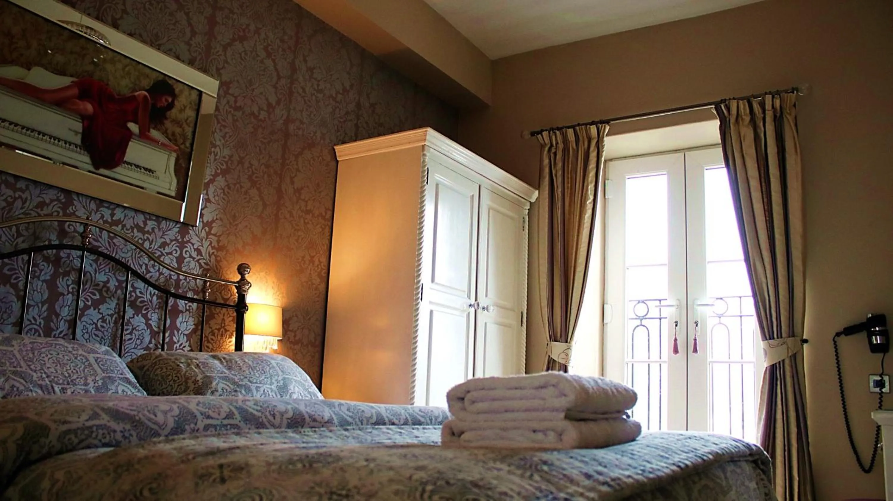 Bed in Bowness Bay Suites