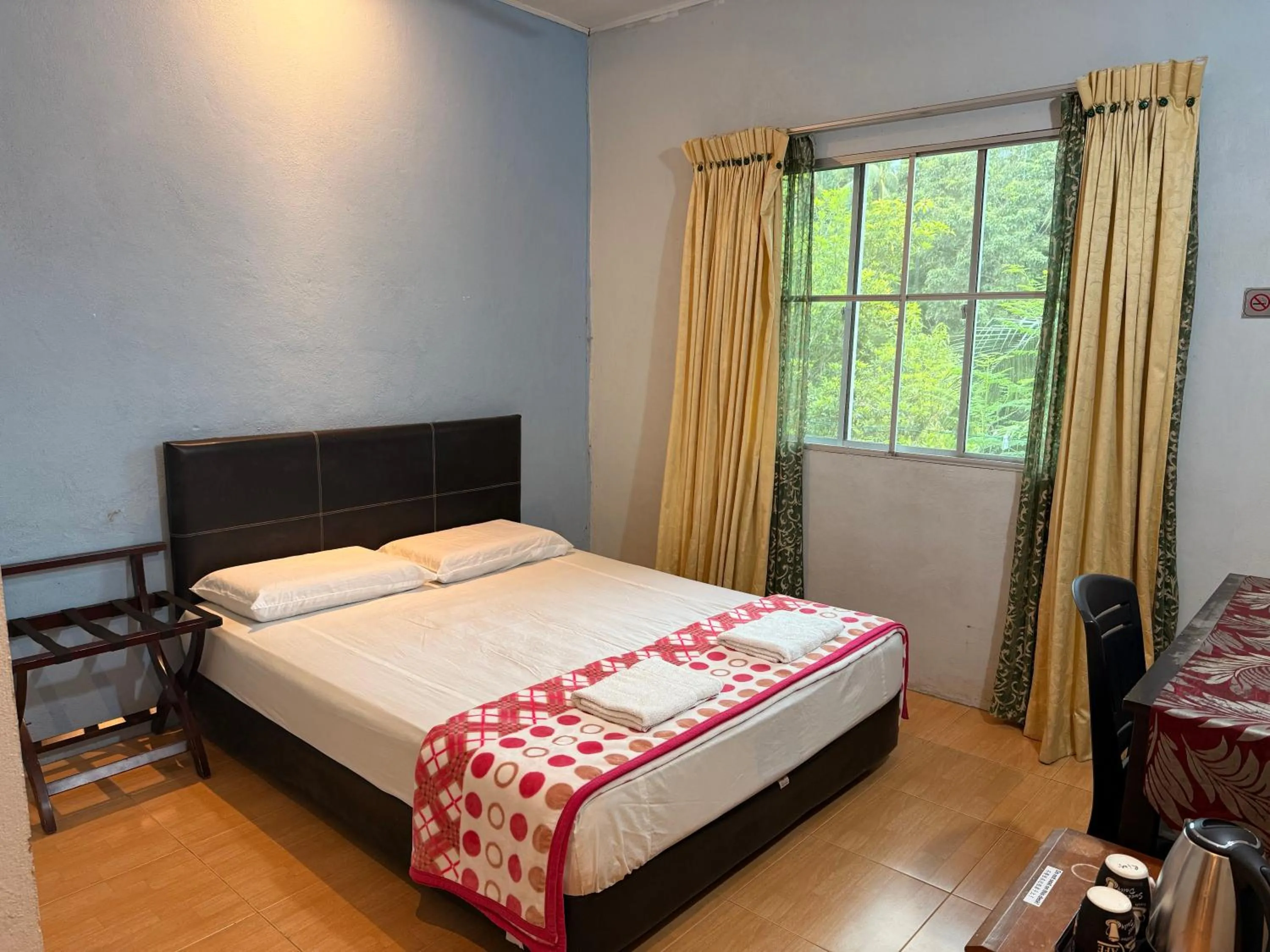 Bed in RTMS Guesthouse Semporna