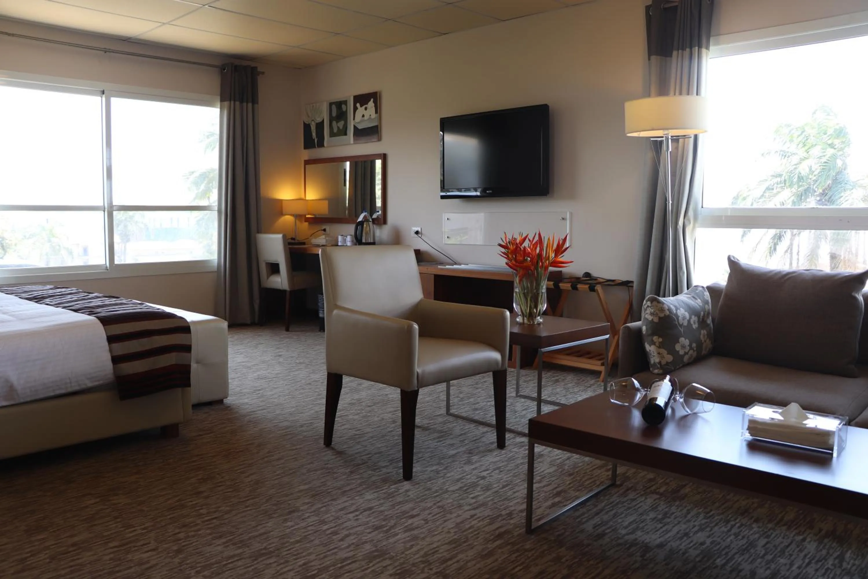 Living room, Bed in Mamba Point Hotel