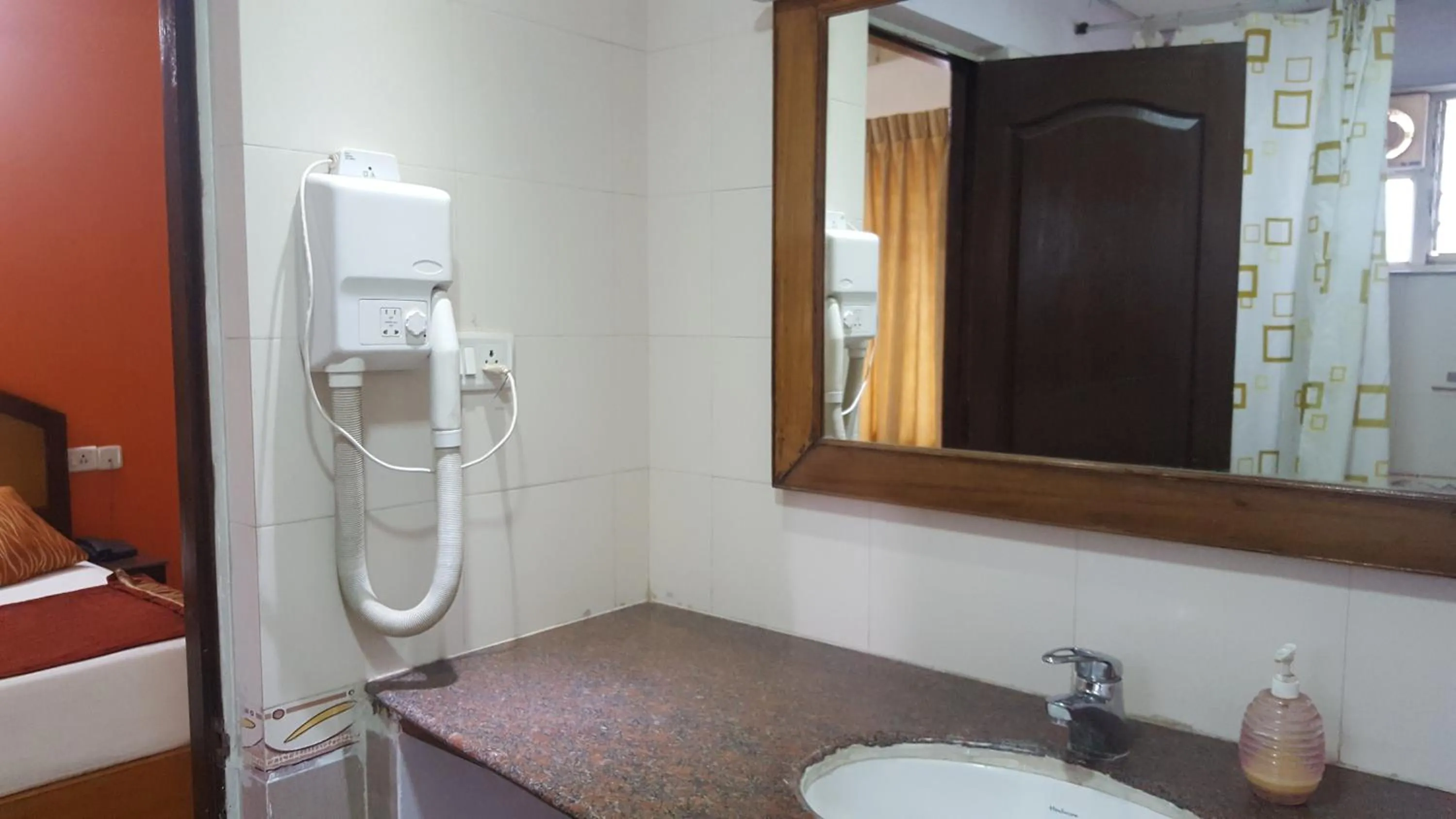 Bathroom in Maple Suites