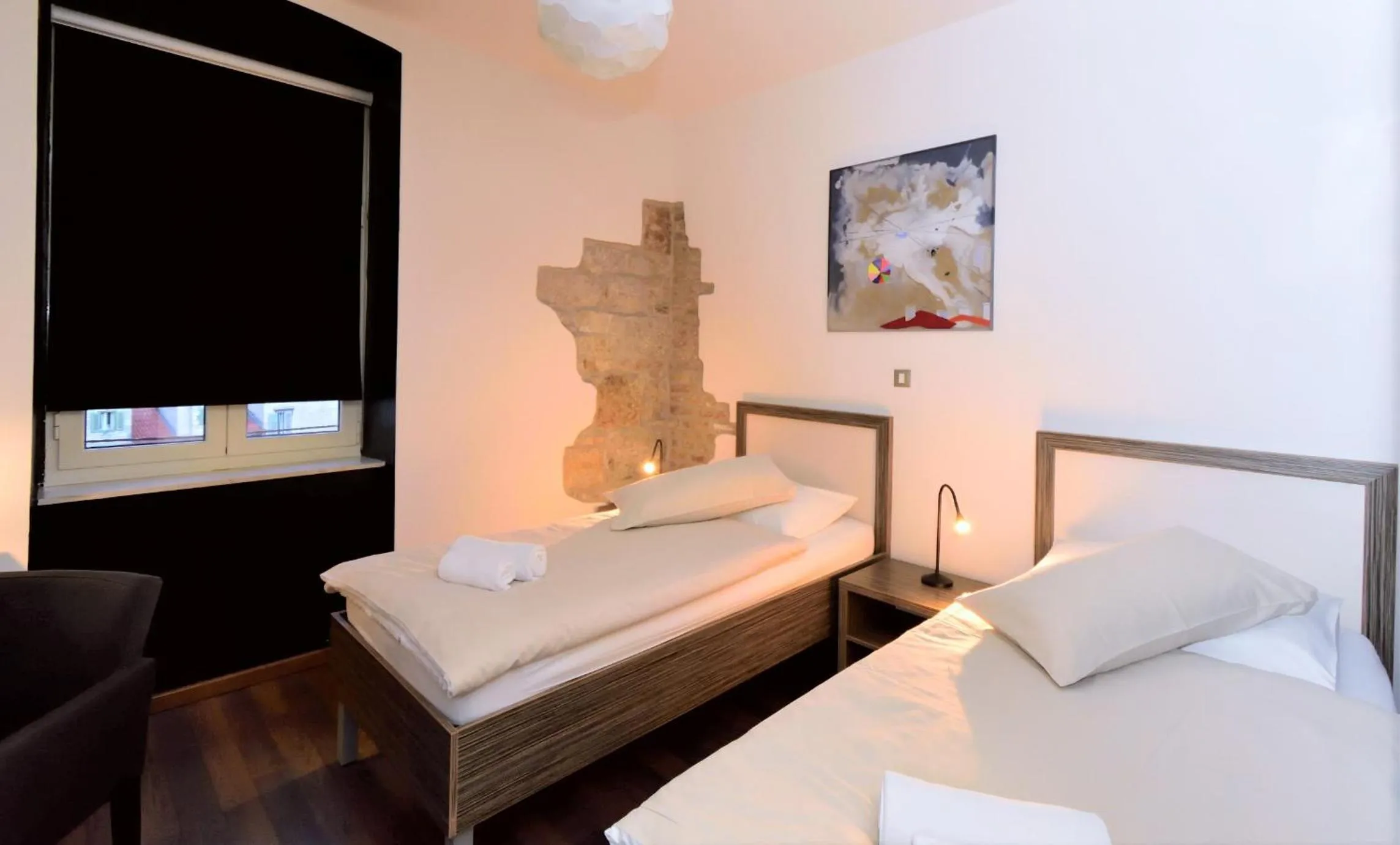 Bed in Marmontova Luxury Rooms