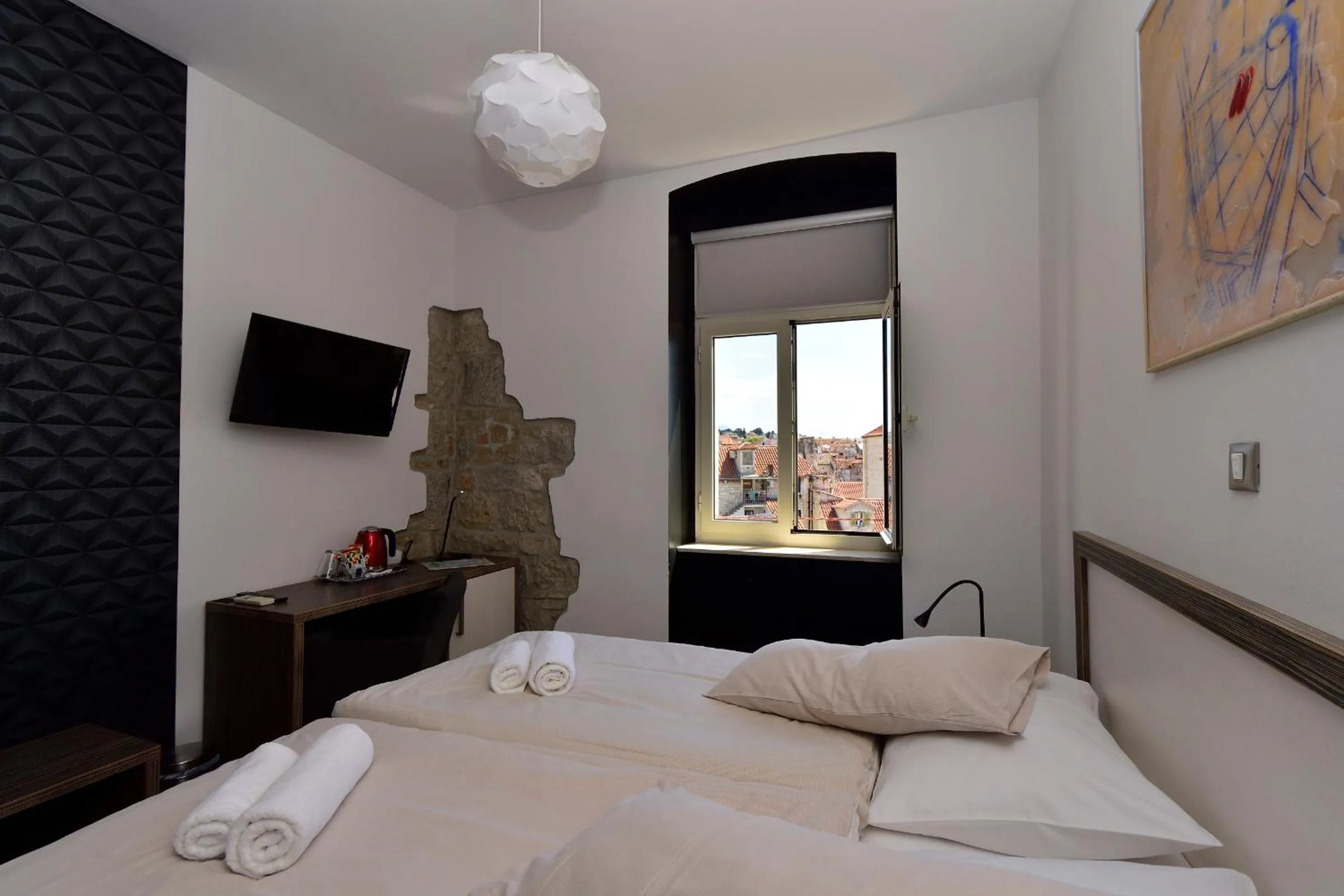 Bed in Marmontova Luxury Rooms