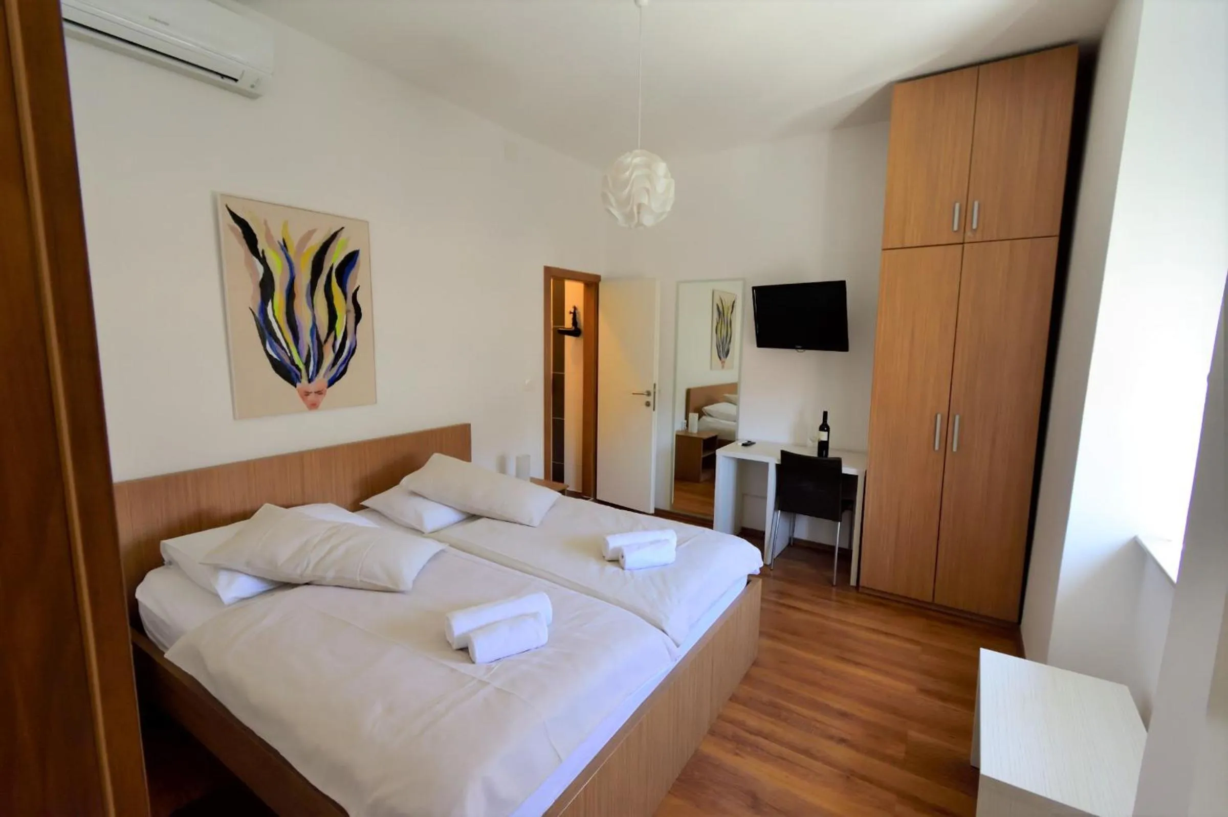 Bed in Marmontova Luxury Rooms