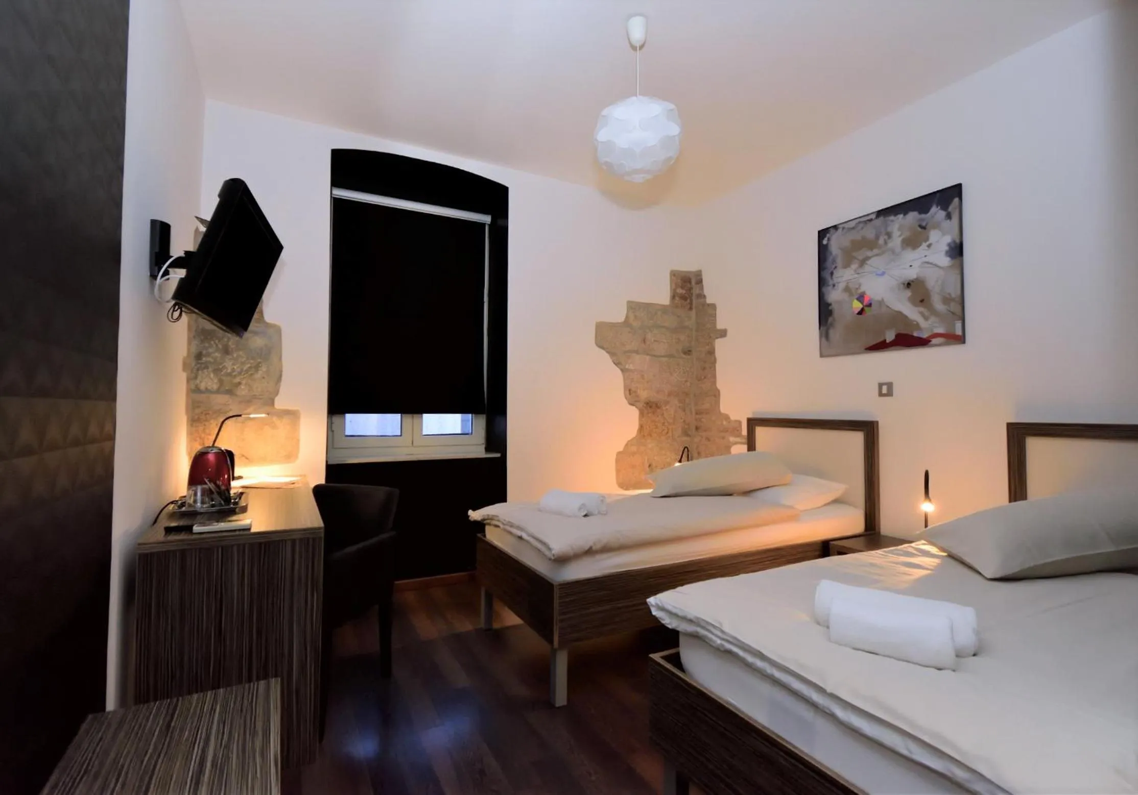 Bed in Marmontova Luxury Rooms