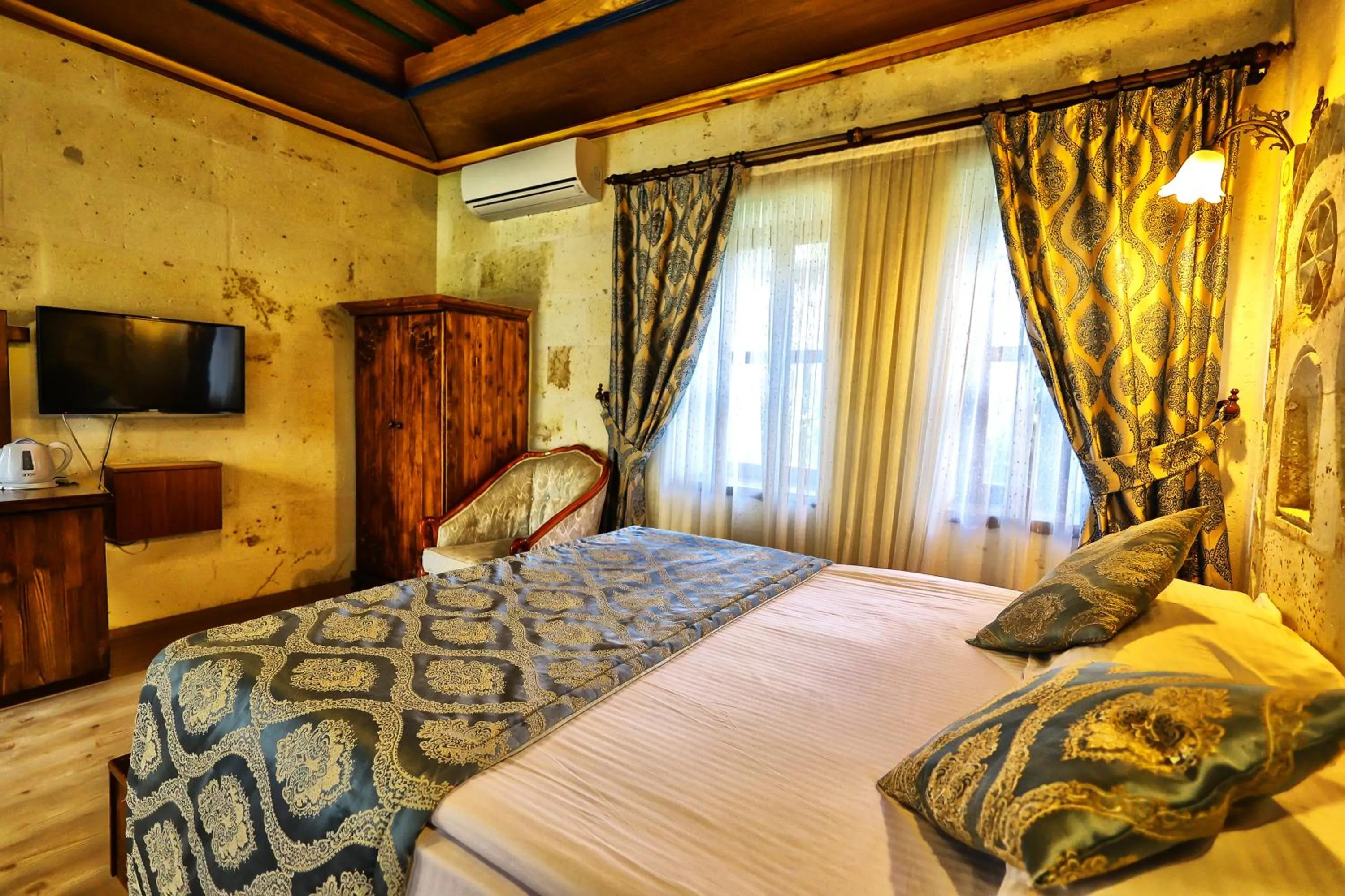 Bed in Cappadocia Empire Cave Hotel