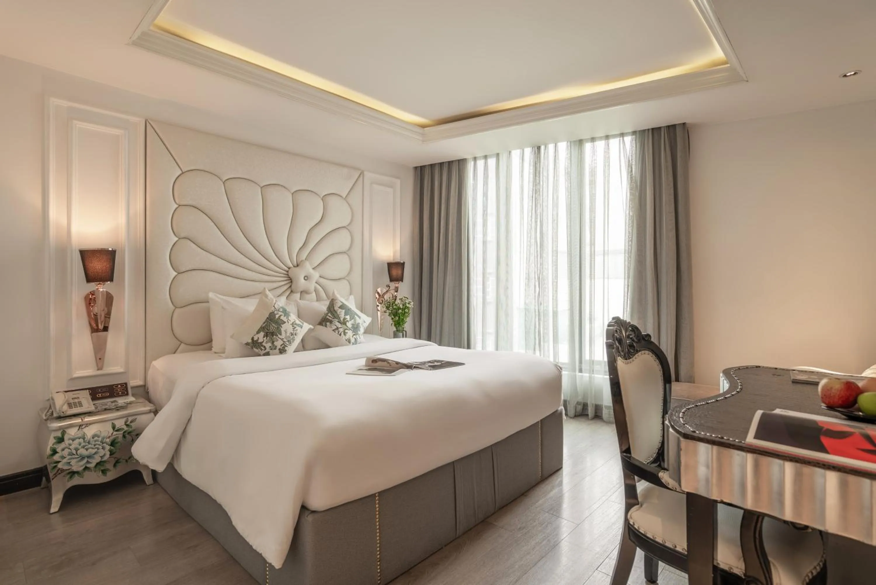 Bed in A&EM Saigon Hotel