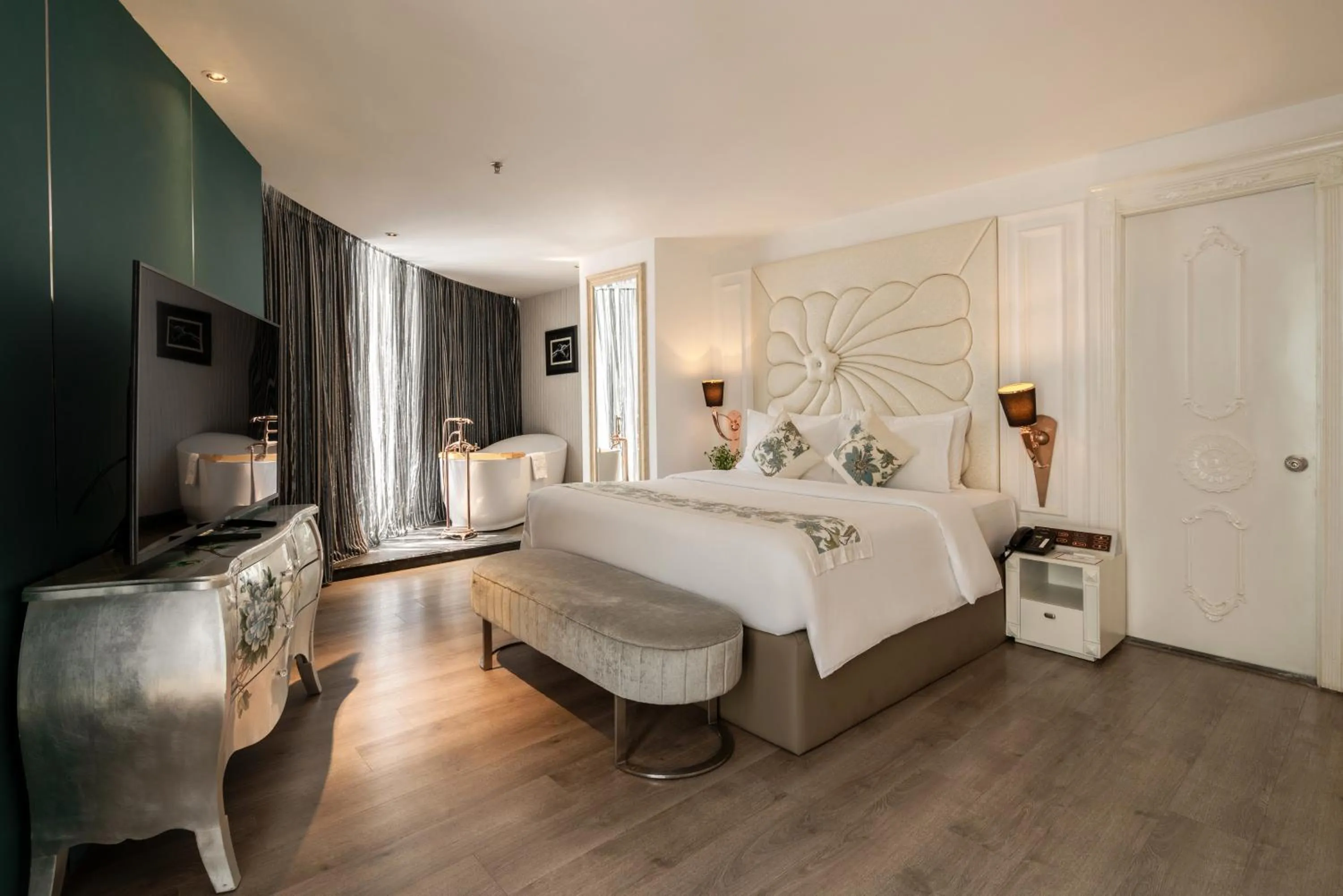 Bed in A&EM Saigon Hotel