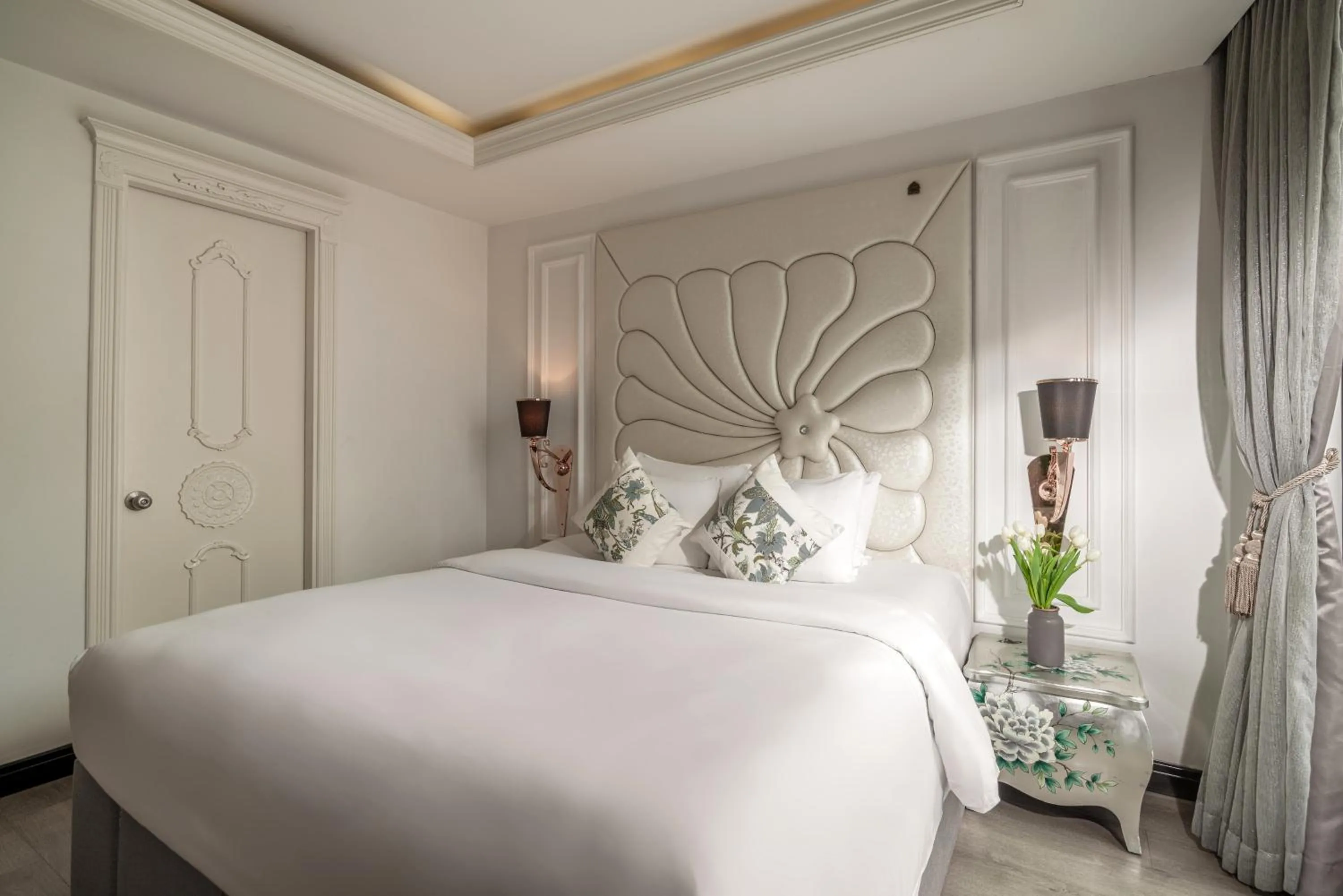 Bed in A&EM Saigon Hotel