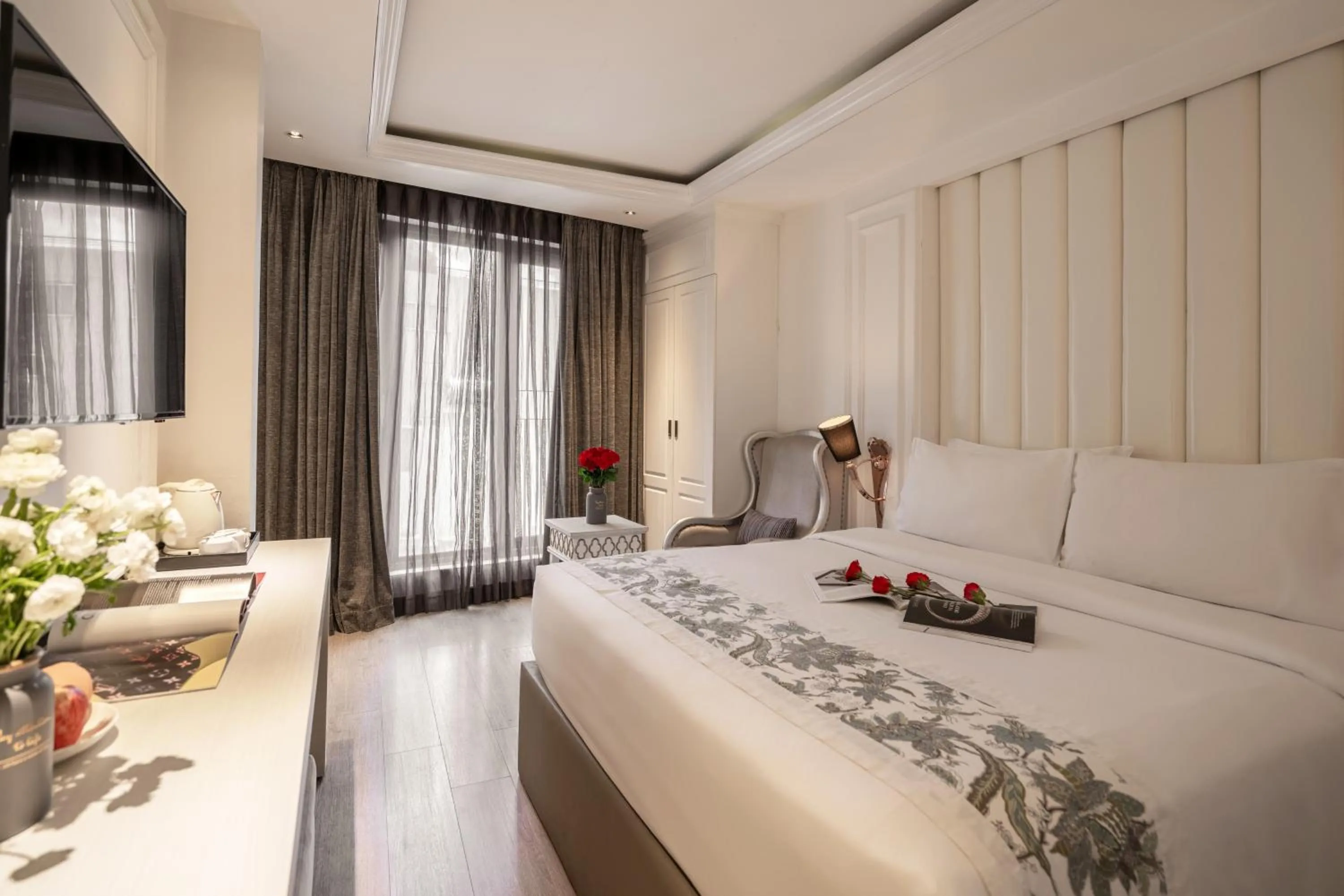 Bed in A&EM Saigon Hotel