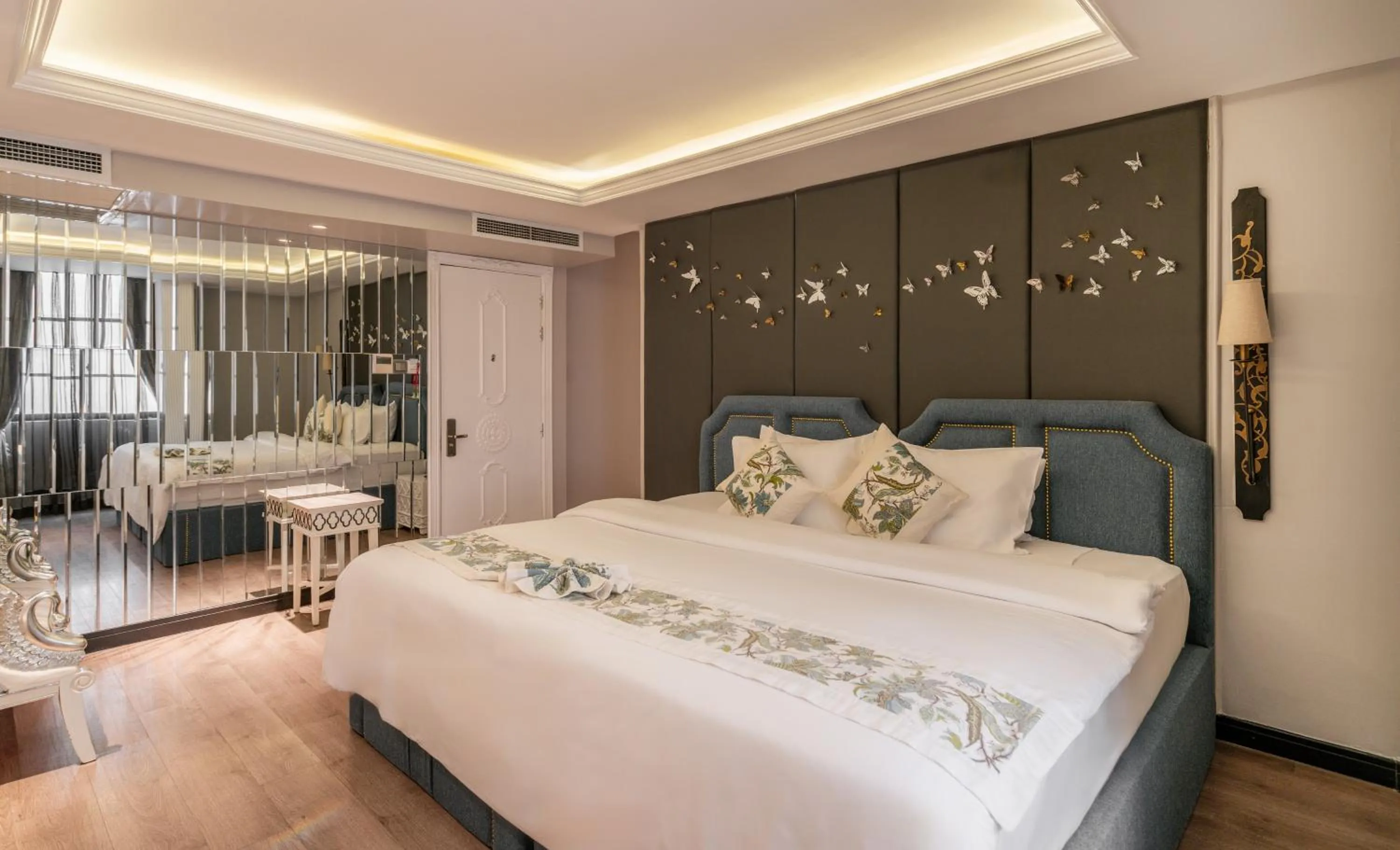 Bed in A&EM Saigon Hotel