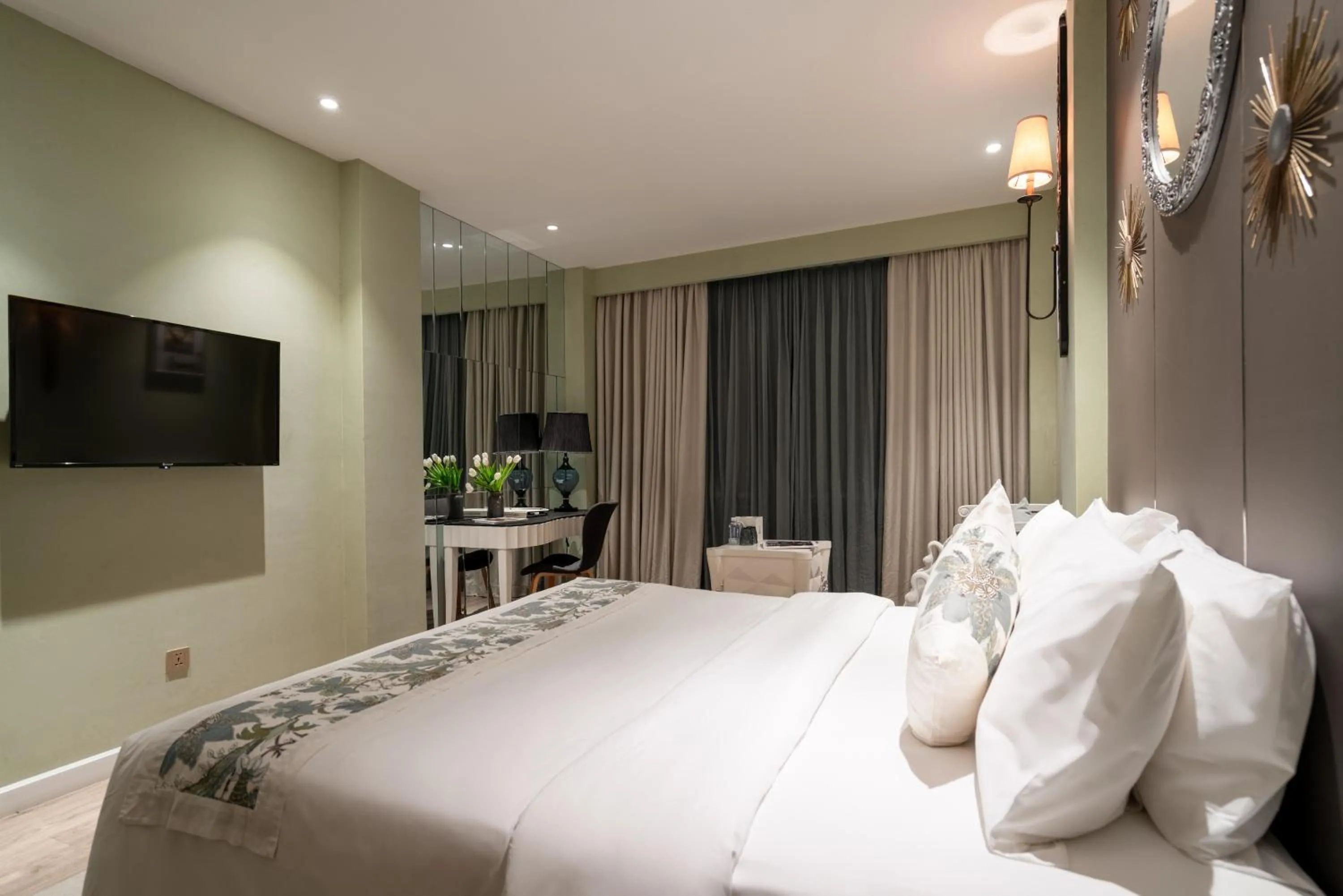 Bed in A&EM Saigon Hotel